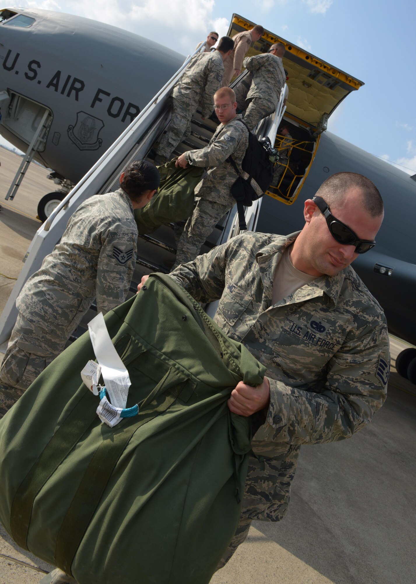 Airmen arriving onboard a KC-135 Stratotanker unload baggage from the plane Aug. 10, 2015, at Incirlik Air Base, Turkey. The U.S. Air Force deployed six F-16 Fighting Falcons from Aviano Air Base, Italy, support equipment and approximately 300 personnel to Incirlik AB in support of Operation Inherent Resolve. (U.S. Air Force photo by Senior Airman Krystal Ardrey/Released)
