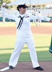 Petty Officer 2nd Class Elizabeth Tototzintle from the Navy Recruiting District San Antonio winds up to deliver the ceremonial first pitch before the start of the Texas League game between the San Antonio Mission and Corpus Christi Hooks at Nelson Wolff Stadium in San Antonio Aug. 5. More than 5,500 people attended the game where the Missions players honored the men and women in the U.S. military by wearing camouflage uniforms and hats.