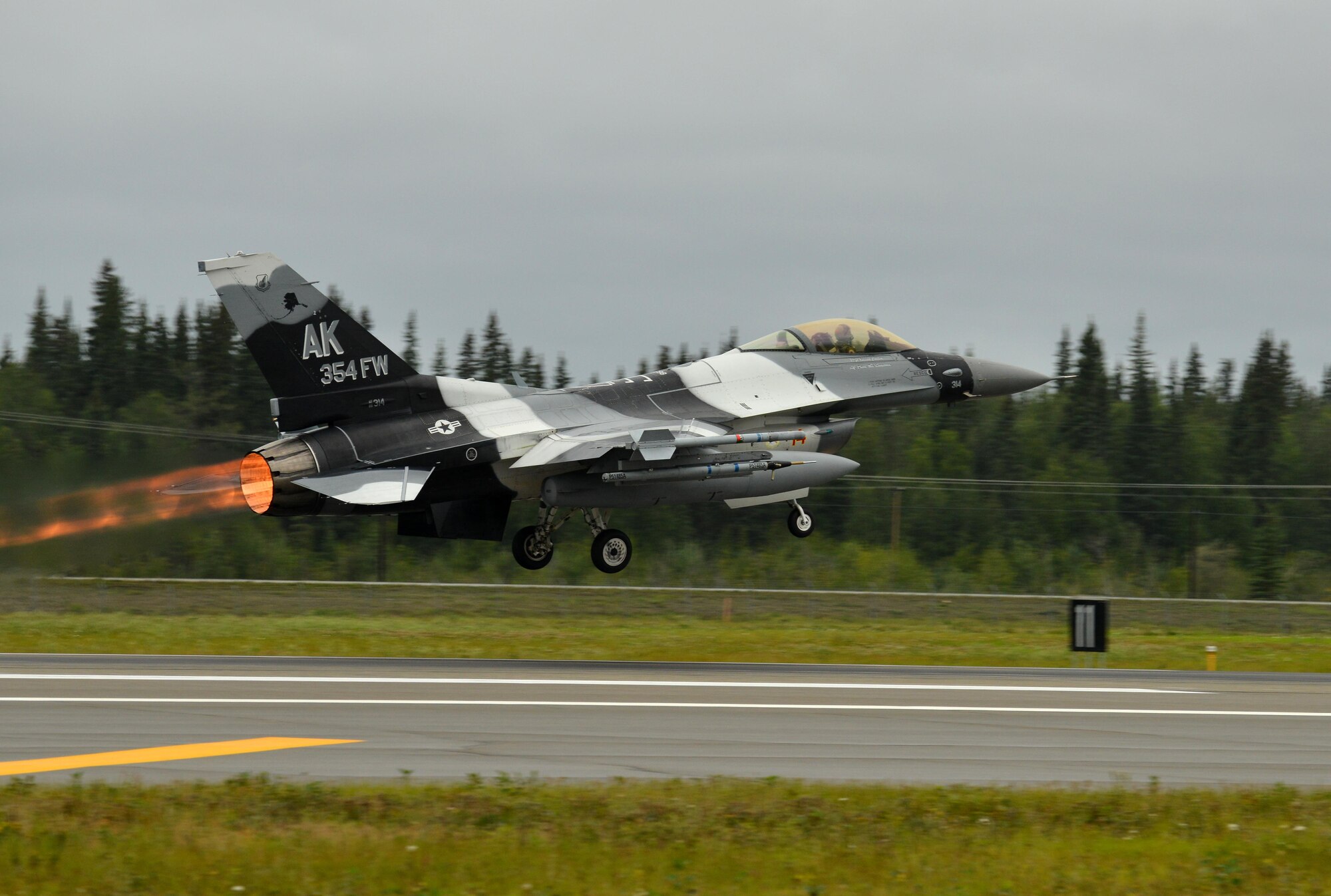 A U.S. Air Force F-16 Fighting Falcon assigned to the 18th Aggressor Squadron takes off from the Eielson Air Force Base, Alaska, flightline Aug. 10, 2015, as part of the first simulated combat sortie of RED FLAG-Alaska, 15-3. The Aggressors are participating as opposing forces during this Pacific Air Forces commander-directed field training exercise for U.S. and partner nation forces, providing combined offensive counter-air, interdiction, close air support, and large force employment training in a simulated combat environment. (U.S. Air Force photo by Airman 1st Class Kyle Johnson/Released)