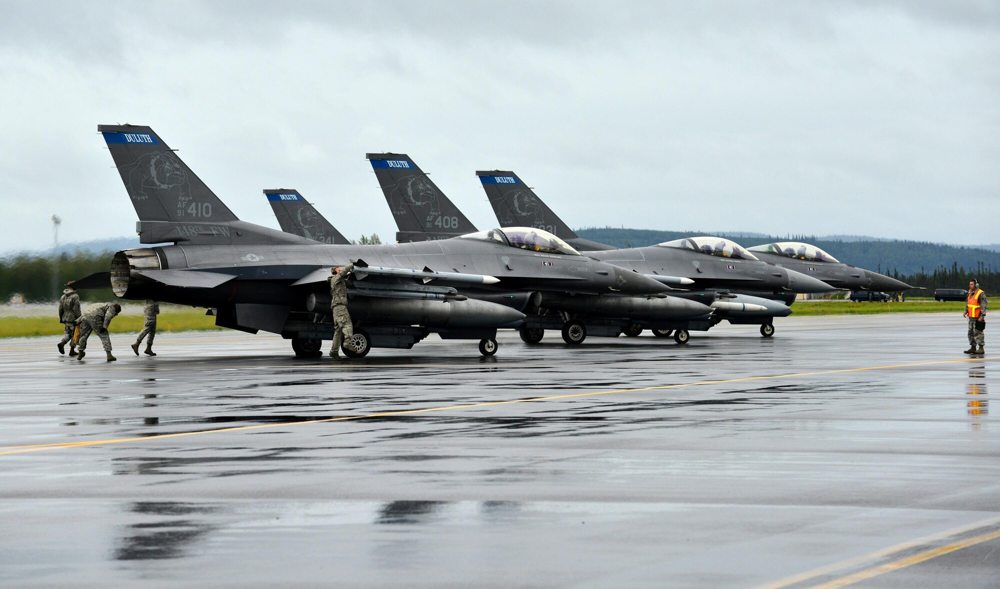U.S. Air Force maintenance Airmen prepare F-16 Fighting Falcons assigned to the Air National Guard’s 179th Fighter Squadron, out of Duluth, Minn. Air National Guard for the first launch of RED FLAG-Alaska 15-3 Aug. 10, 2015, at Eielson Air Force Base, Alaska. The Minnesota ANG is participating in this Pacific Air Forces commander-directed field training exercise for U.S. and partner nation forces, providing combined offensive counter-air, interdiction, close air support, and large force employment training in a simulated combat environment. (U.S. Air Force photo by Airman 1st Class Kyle Johnson/Released)