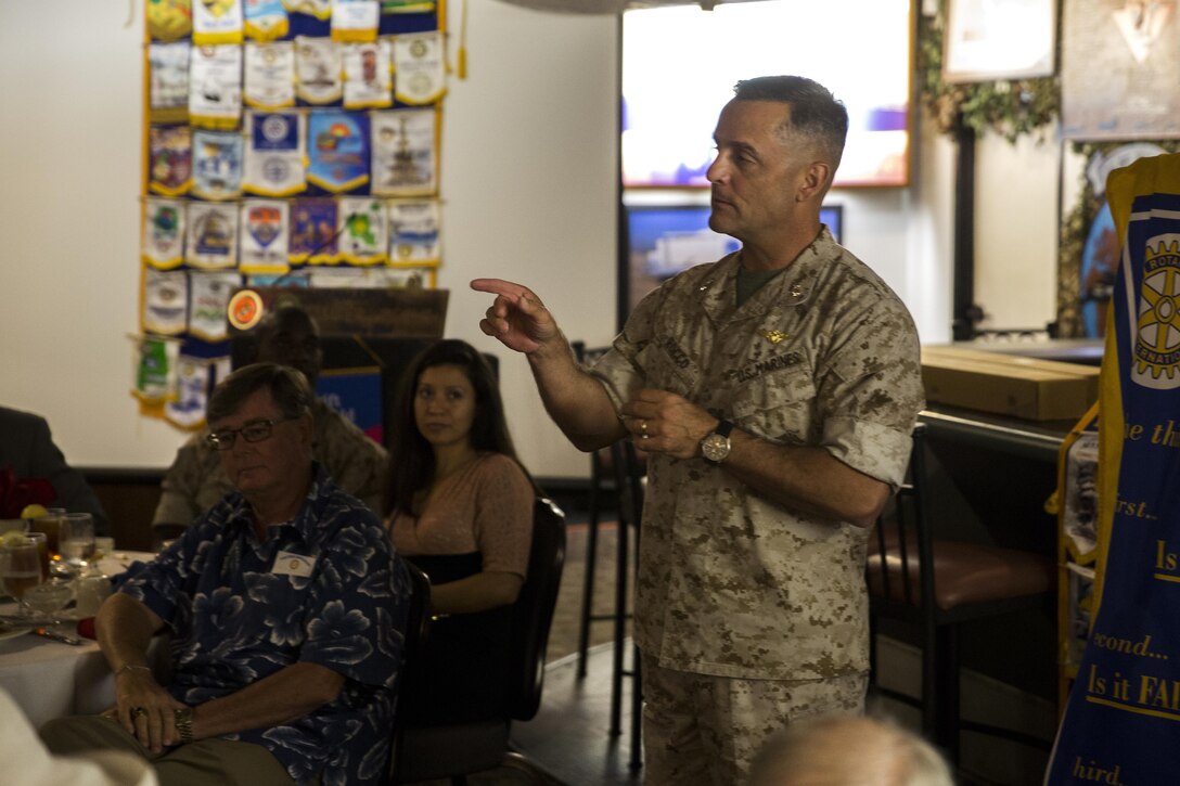 Maj. Gen. Michael Rocco, commanding general of 3rd Marine Aircraft Wing, describes the significance of the different parts of 3rd MAW during a Miramar Semper Fidelis Rotary Foundation meeting aboard Marine Corps Air Station Miramar, California, Aug. 6. Rocco also presented noncommissioned officer (NCO) swords to corporal’s course honor graduates at the meeting. (U.S. Marine Corps photo by Cpl. Michael Thorn/Released)
