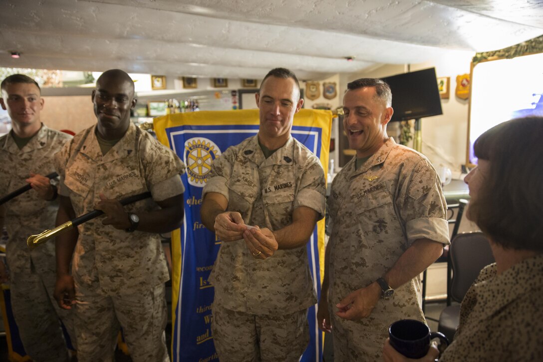 Sgt. Maj. Patrick Kimble, center, reads a name for a prize during a Miramar Semper Fidelis Rotary Foundation meeting aboard Marine Corps Air Station Miramar, California, Aug. 6. The Miramar Semper Fidelis Rotary Foundation took time to recognize honor graduates from the installation’s recent corporal’s course. (U.S. Marine Corps photo by Cpl. Michael Thorn/Released)