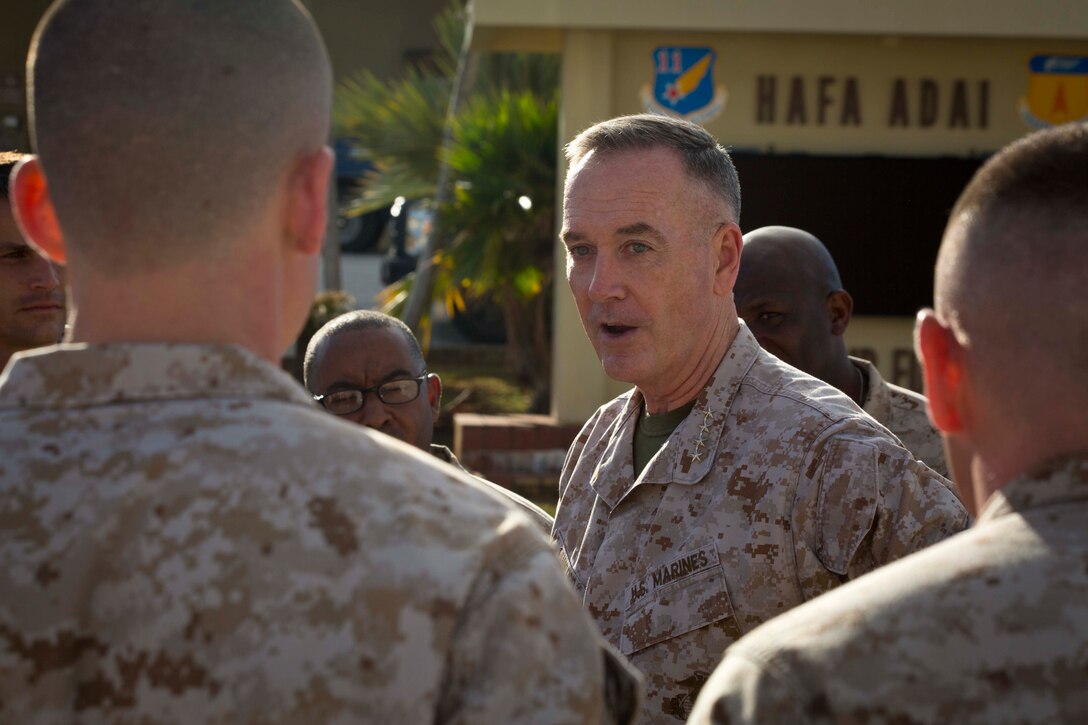 Commandant of the Marine Corps Gen. Joseph Dunford Jr., Meets with the Marines from Marine Corps Activity Guam, at Anderson Air Force Base, Yigo Guam, March 21, 2015. Gen. Dunford and Sgt. Maj. of the Marine Corps, Ronald Green, will attend the 70th anniversary for the Battle of Iwo Jima, along witht the veterans that fought during World War Two. (U.S. Marine Corps photo by Lance Cpl. Jacob Snouffer/Released) 