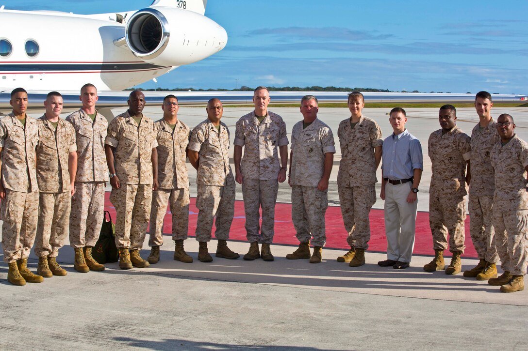 Commandant of the Marine Corps Gen. Joseph Dunford Jr., Meets with the Marines from Marine Corps Activity Guam, at Anderson Air Force Base, Yigo Guam, March 21, 2015. Gen. Dunford and Sgt. Maj. of the Marine Corps, Ronald Green, will attend the 70th anniversary for the Battle of Iwo Jima, along witht the veterans that fought during World War Two. (U.S. Marine Corps photo by Lance Cpl. Jacob Snouffer/Released) 