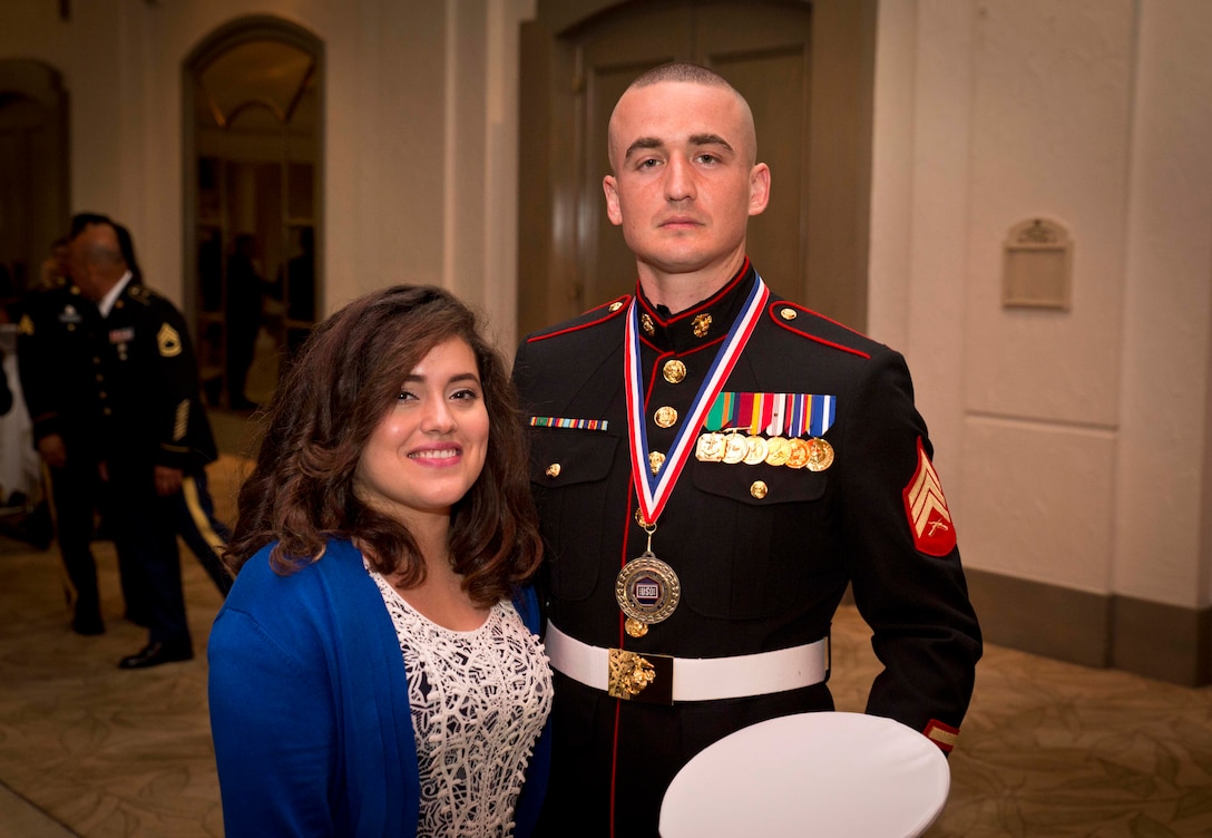 TUMON, Guam (March 9, 2015) --U.S. Marine Corps Sergeant German Trevizo stands with his wife Nancy Trevizo before the United Service Organization Six Star Service Salute Event. The night consisted of a music performance by the USO Show Troupe, a speech from retired Army Col Gregory D. Gadson, and awards given to each branch of service for the USO Service member of the year. (U.S. Marine Corps photo by Lance Cpl. Jacob Snouffer/Released)