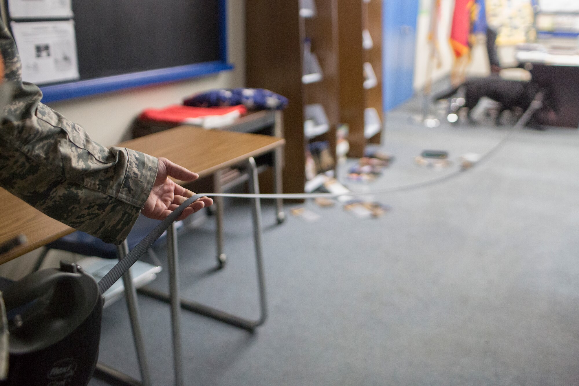 Staff Sgt. Edward Stewart, 374th Security Forces Squadron military working dog handler, and Stella, 374th SFS military working dog, searches for simulated unknown objects on a building at Yokota Air Base, Japan, Aug. 6, 2015. Yokota’s MWD section is trained in environments mirroring every predictable real-world scenario. (U.S. Air Force photo by Osakabe Yasuo/Released)