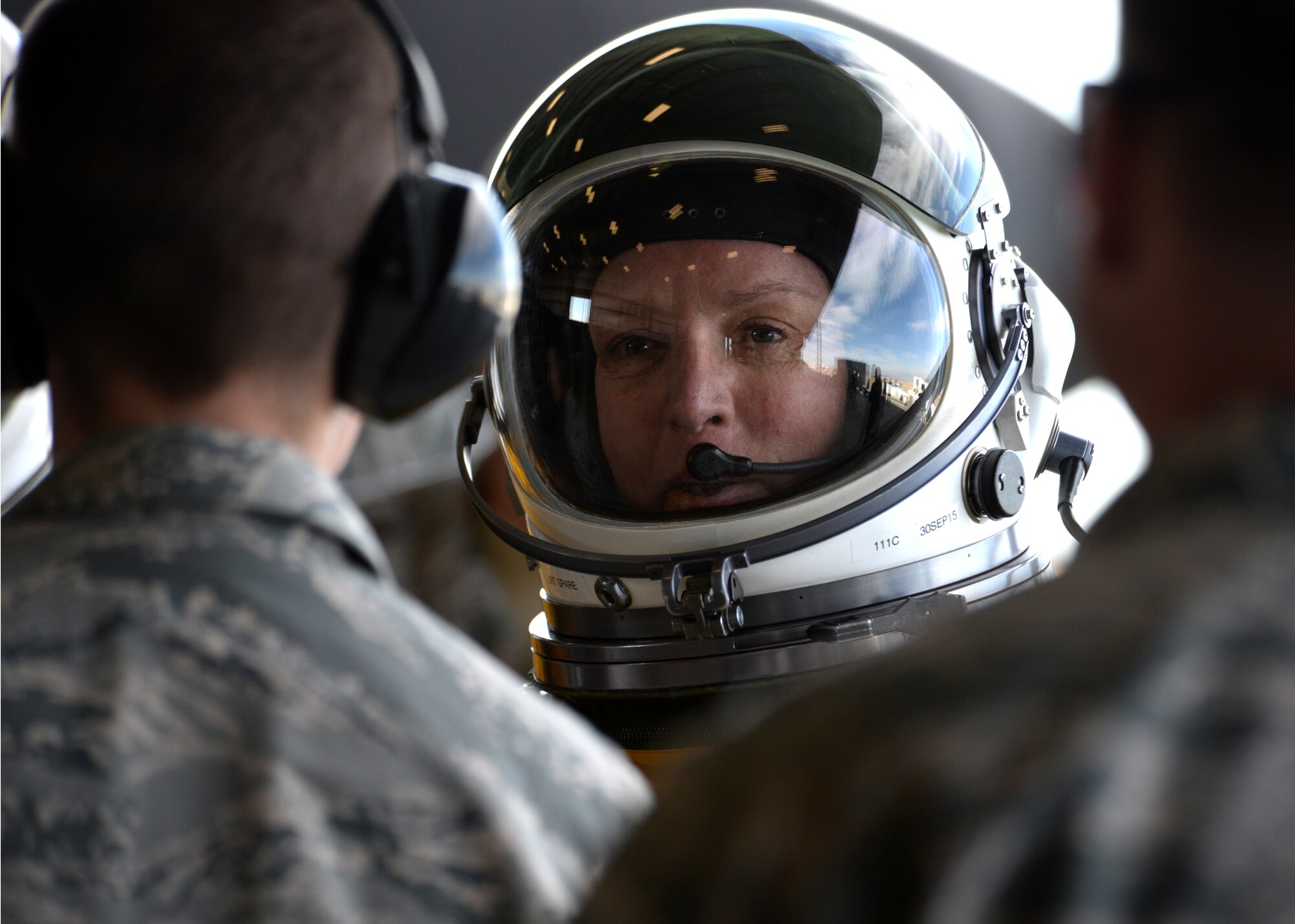 Secretary of the Air Force Deborah Lee James shakes hands with maintenance Airmen from the 9th Aircraft Maintenance Squadron before flying in a U-2 Dragon Lady at Beale Air Force Base, California, Aug. 11, 2015.  The specialized pressure suit allows U-2 pilots to safely fly at altitudes reaching 70,000 feet. James visited Beale to receive a first-hand perspective of high-altitude intelligence, surveillance and reconnaissance from collection to dissemination. (U.S. Air Force photo by Airman 1st Class Ramon A. Adelan)