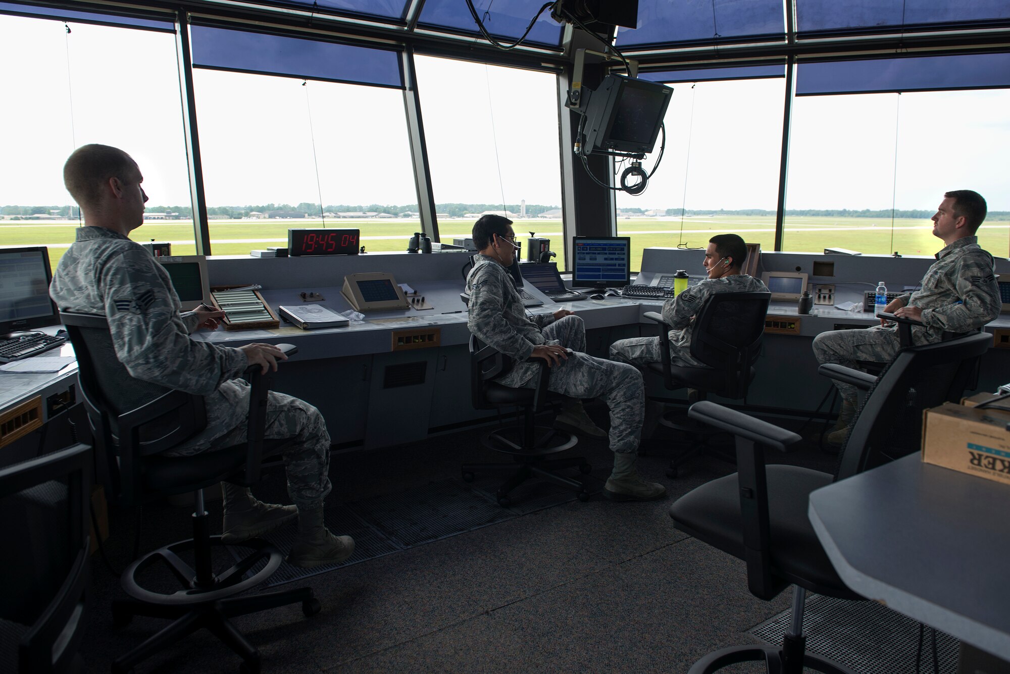 Air traffic controllers sit in the Tower Cab Aug. 11, 2015, at Moody Air Force Base, Ga. In the Tower Cab, controllers monitor aircraft and communicate with pilots in order to prevent accidents. (U.S. Air Force photo by Airman 1st Class Kathleen D. Bryant/Released)
