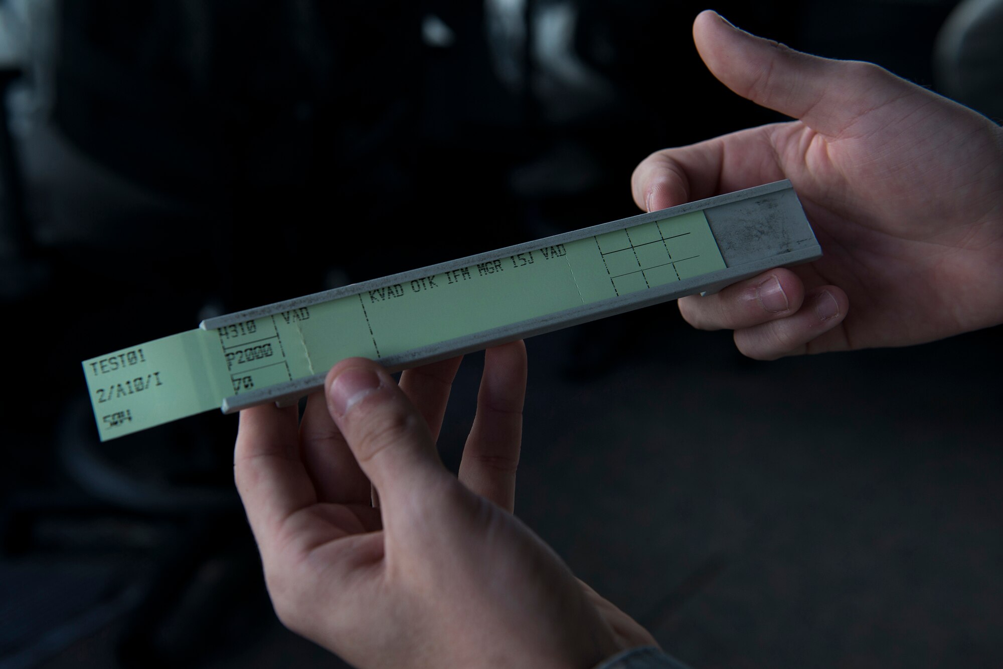 An air traffic controller prepares a flight-progress check test strip for display Aug. 11, 2015, at Moody Air Force Base, Ga. Every aircraft is assigned this essential ‘flight plan’ to keep track of the aircraft’s name, type, number, departure and arrival time. (U.S. Air Force photo by Airman 1st Class Kathleen D. Bryant/Released)


