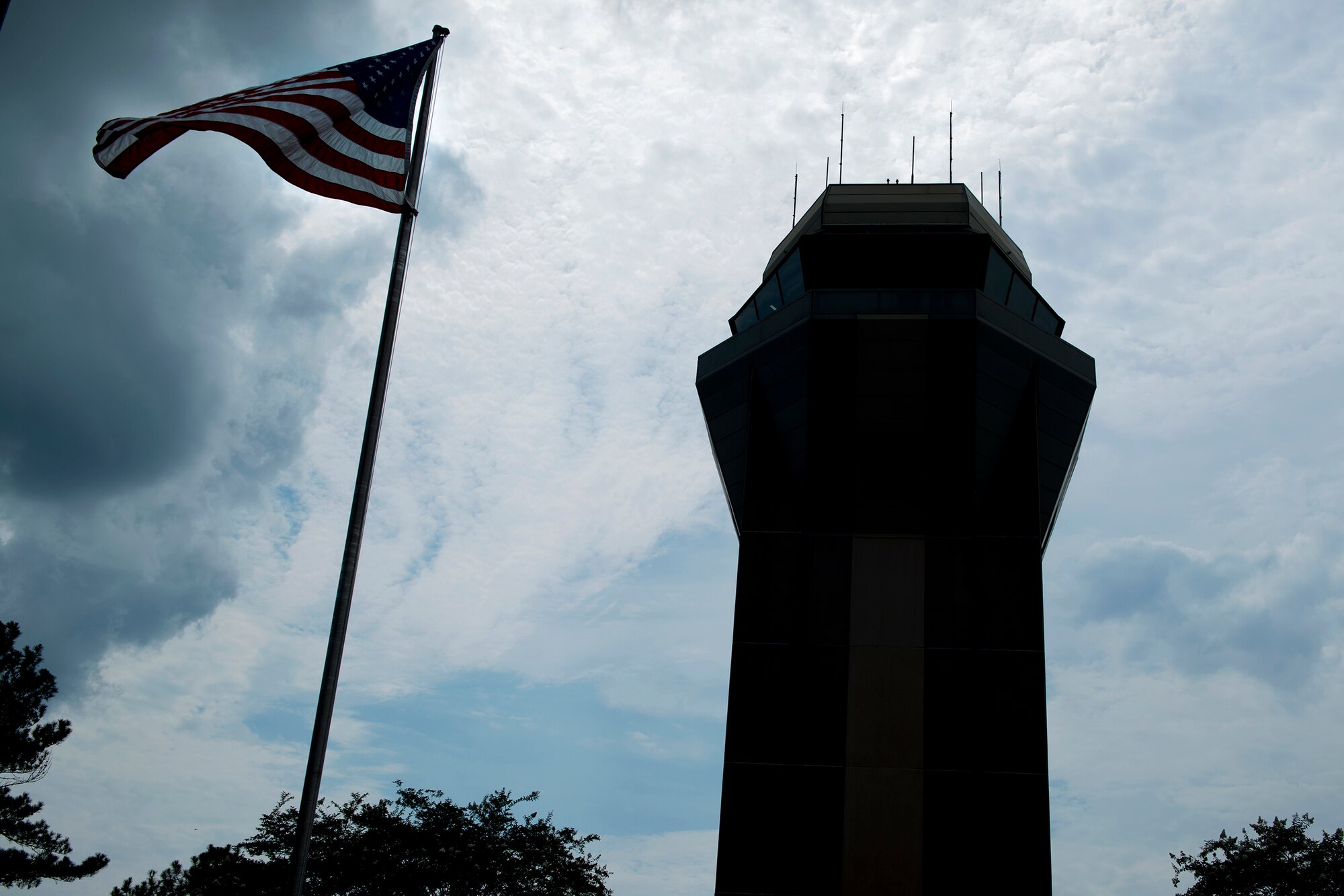 The Air Traffic Control Tower stands in front of the flightline Aug. 11, 2015, at Moody Air Force Base, Ga. From the tower, air traffic controllers direct the aircraft movement into and out of the airfield , track aircraft by radar and give voice instructions by radio within a five-mile radius.(U.S. Air Force photo by Airman 1st  Class Kathleen D. Bryant/Released)
