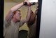 Staff Sgt. Calvin Myers, left, and Tech. Sgt. Luis Garcia-Alvarez, 22nd Civil Engineer Squadron structural craftsmen, install a door in building 1219 Aug. 11, 2015, at McConnell Air Force Base, Kan. More than 20 doors were installed within the last four months. (U.S. Air Force photo by Senior Airman Colby L. Hardin)