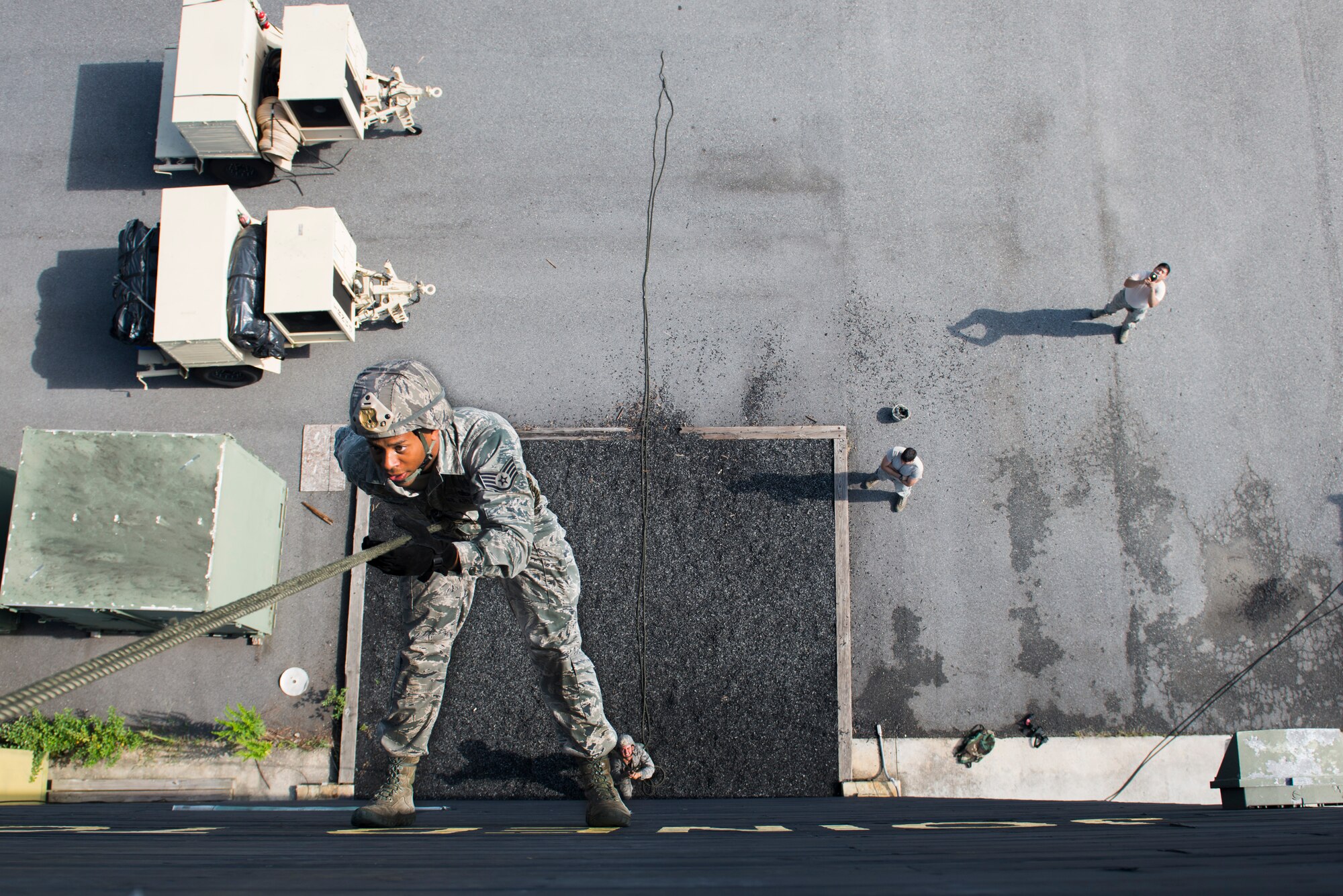U.S. Air Force Staff Sgt. Daniel Centreras, 822d Base Defense Squadron fire team leader, rappels down the Safeside Rappel Tower Aug. 5, 2015, at Moody Air Force Base, Ga. For the safety of Centreras, medical coverage and rappel spotters were on-scene during his rappel. (U.S. Air Force photo by Airman 1st Class Dillian Bamman/Released)