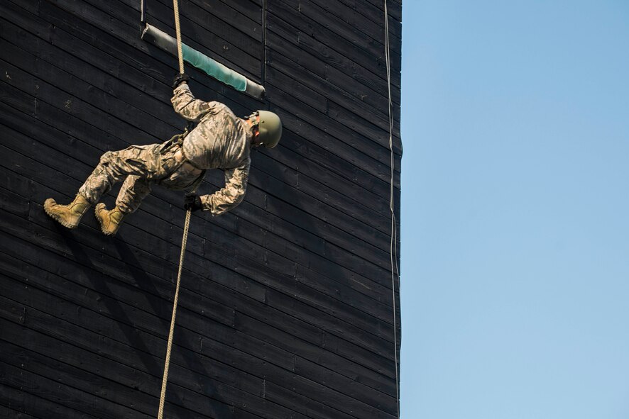 U.S. Air Force Staff Sgt. Tyler Hodge, 820th Combat Operations Squadron communications technician, rappels down the Safeside Rappel Tower Aug. 5, 2015, at Moody Air Force Base, Ga. The Rappel Tower Program serves as training for Moody’s base defenders to enhance their capabilities. The program also prepares them for Air Assault School, an advanced course for seasoned defenders. (U.S. Air Force photo by Airman 1st Class Dillian Bamman/Released)
