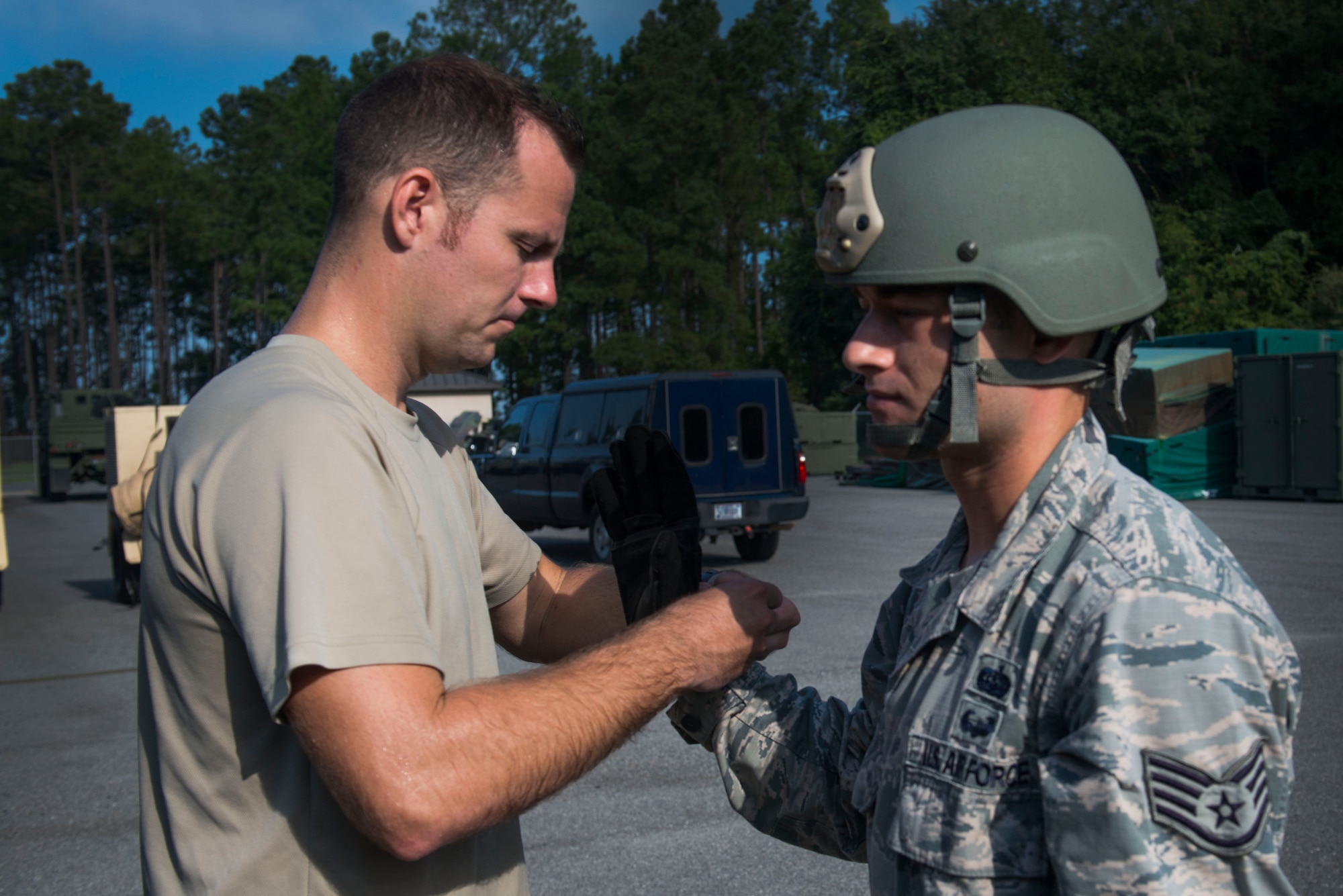 U.S. Air Force Staff Sgt. Michael Kearns (left), 820th Base Defense Group rappel master, checks Staff Sgt. Tyler Hodge, 820th Combat Operations Squadron communications technician, and his equipment before a rappel Aug. 5, 2015, at Moody Air Force Base, Ga. In addition to safety checks, the defenders provided medical coverage, rappel spotters and rappel seat inspections during each rappel. (U.S. Air Force photo by Airman 1st Class Dillian Bamman/Released)
