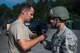 U.S. Air Force Staff Sgt. Michael Kearns (left), 820th Base Defense Group rappel master, checks Staff Sgt. Tyler Hodge, 820th Combat Operations Squadron communications technician, and his equipment before a rappel Aug. 5, 2015, at Moody Air Force Base, Ga. In addition to safety checks, the defenders provided medical coverage, rappel spotters and rappel seat inspections during each rappel. (U.S. Air Force photo by Airman 1st Class Dillian Bamman/Released)