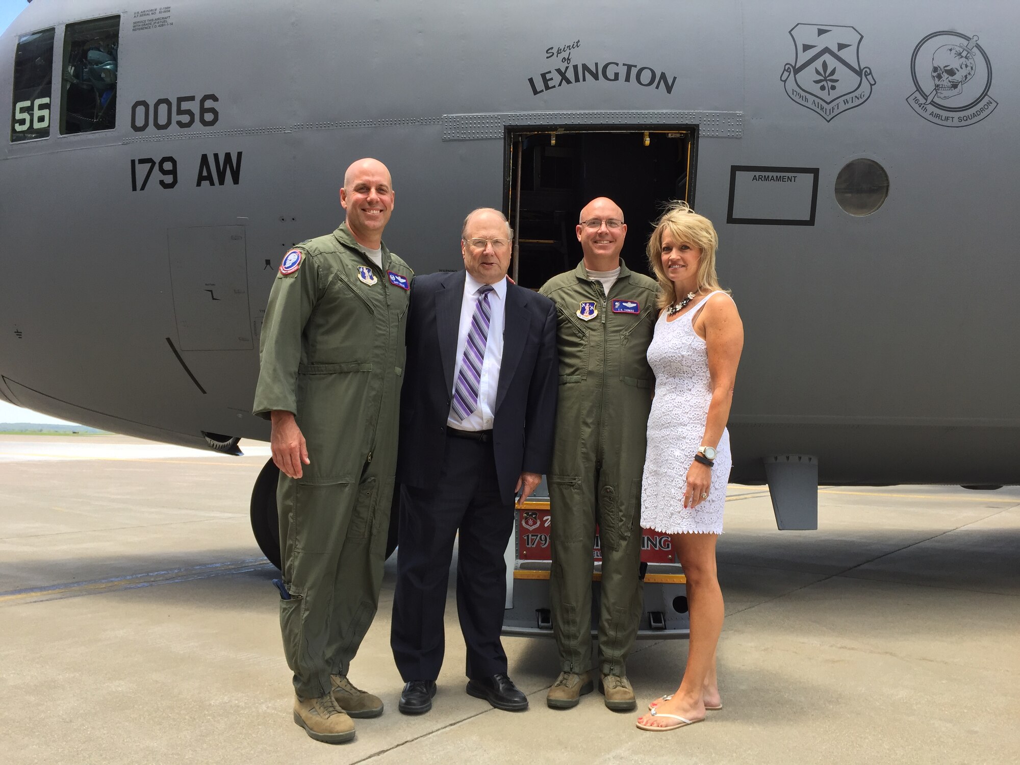 179th Airlift Wing Commander, Col. Gary McCue, joins Lexington Mayor Eugene Parkison and Maintenance Group Commander, Col. Todd Thomas and his wife Debbie on the flight line of Mansfield Lahm Airport, Mansfield, Ohio, to christen a C-130H Hercules as "The Spirit of Lexington", July 16, 2015. The 179th Airlift Wing welcomed Lexington Mayor, Eugene Parkison to the ceremony. Each of the eight aircraft assigned are being dedicated to supportive local communities. (courtesy photo) — at 179th Airlift Wing & 200th RED HORSE.