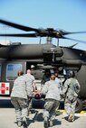 Airmen and soldiers participate in a Major Accident Response Exercise at Malmstrom Air Force Base, Mont., August 10, 2015. Base personnel and the Montana National Guard worked together in the MARE to demonstrate emergency response readiness to medically transport casualties. (U.S. Air Force photo/Airman 1st Class Magen M. Reeves)