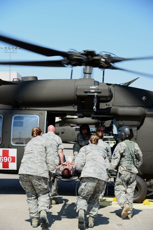 Airmen and soldiers participate in a Major Accident Response Exercise at Malmstrom Air Force Base, Mont., August 10, 2015. Base personnel and the Montana National Guard worked together in the MARE to demonstrate emergency response readiness to medically transport casualties. (U.S. Air Force photo/Airman 1st Class Magen M. Reeves)