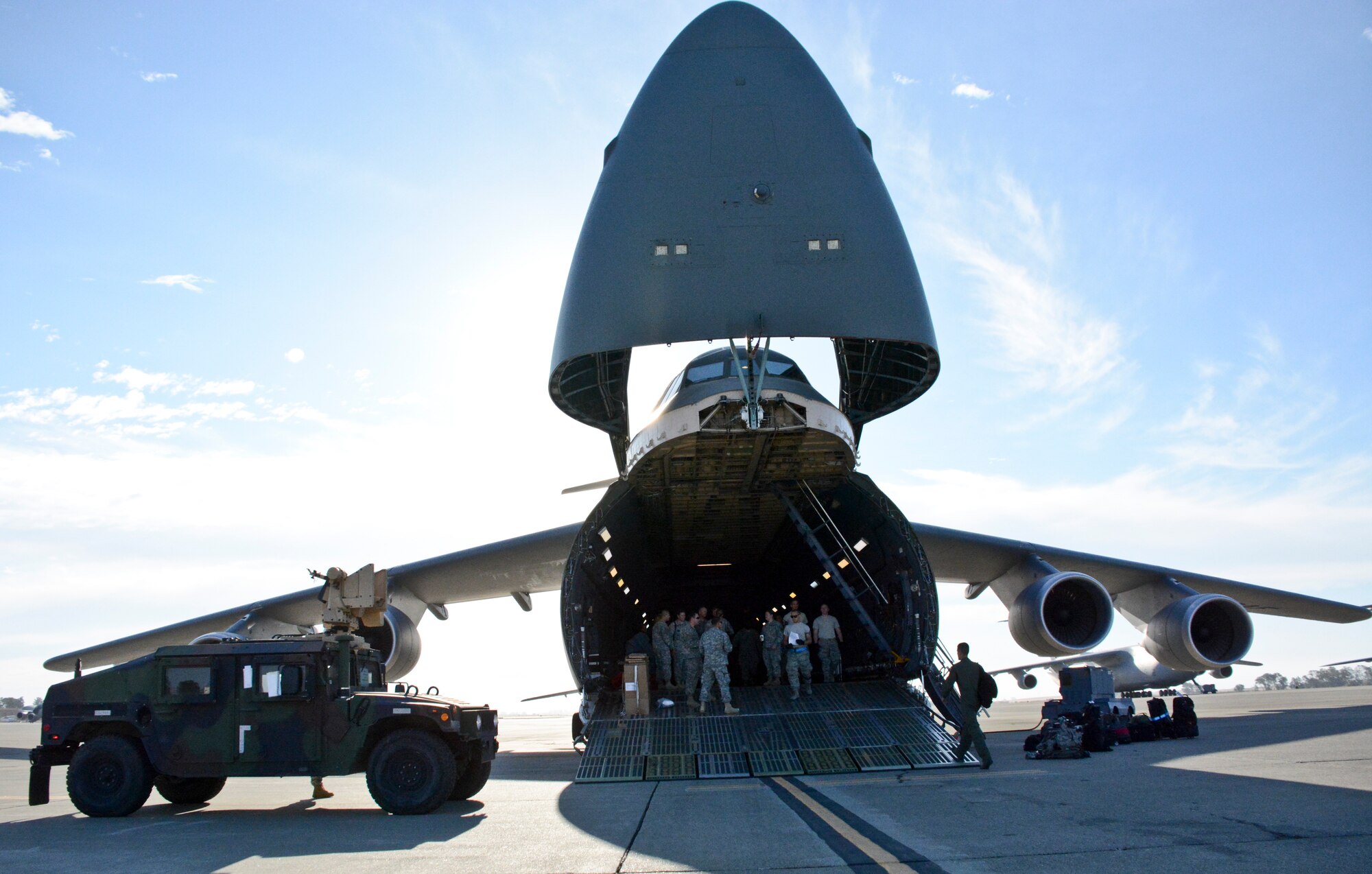 A C-5M Super Galaxy is loaded Aug. 7 at Travis Air Force Base, California, during Exercise Eagle Walk. The purpose of the exercise is to enhance readiness and put their training into practice. The key mission of the National Guard is to provide civil support in emergencies and disasters. (U.S. Air Force photo by Airman 1st Class Amber Carter)