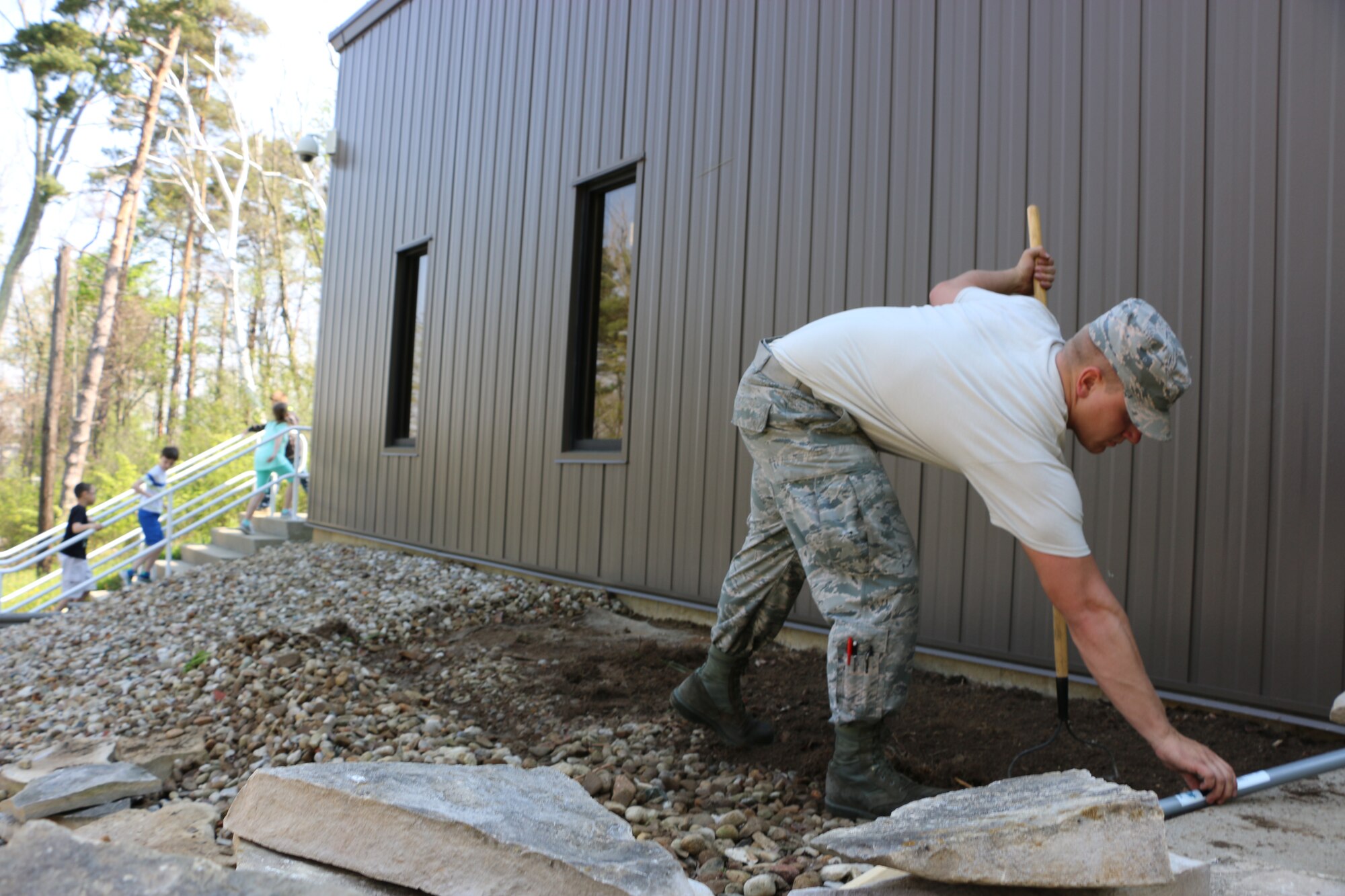 Members of the 179th Airlift Wing and 200th RED HORSE volunteer to clean up in several locations around Mansfield, Ohio, as they observe Earth Day on May 7, 2015. Airmen help clean up local parks and gardens alongside volunteers from the North End Community Improvement Collaborative (NECIC) as well as joining children from schools and community centers.  (U.S. Air National Guard photo by Tech. Sgt. Joe Harwood\Released)