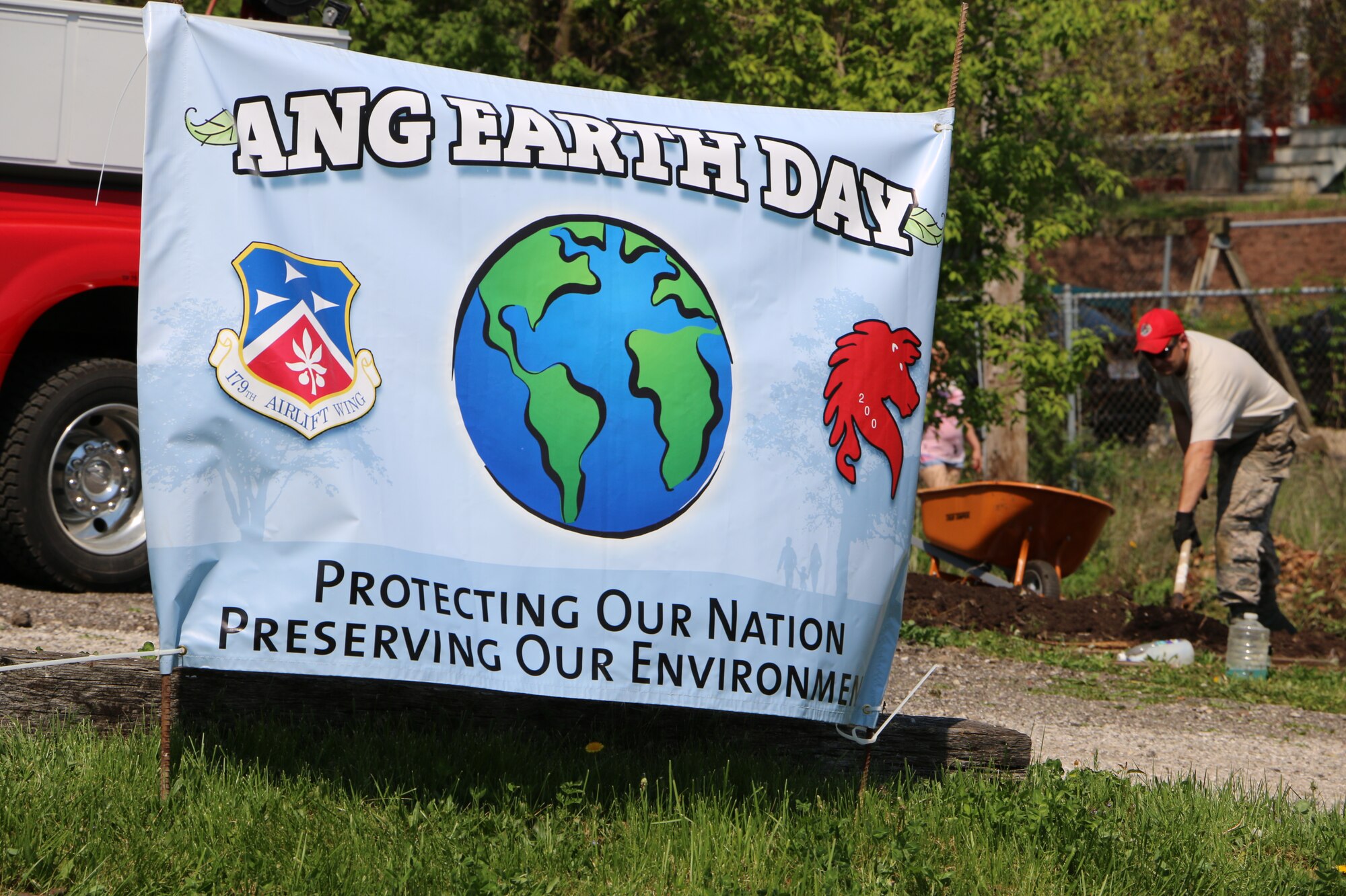 Members of the 179th Airlift Wing and 200th RED HORSE volunteer to clean up in several locations around Mansfield, Ohio, as they observe Earth Day on May 7, 2015. Airmen help clean up local parks and gardens alongside volunteers from the North End Community Improvement Collaborative (NECIC) as well as joining children from schools and community centers.  (U.S. Air National Guard photo by Tech. Sgt. Joe Harwood\Released)