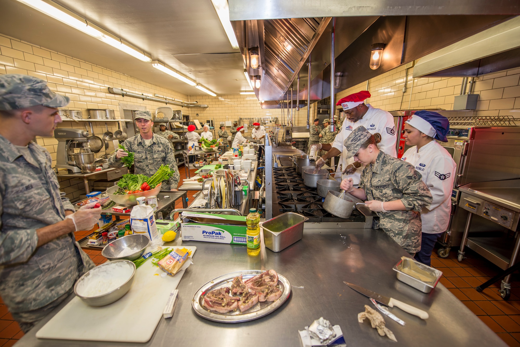 Airmen from the 5th Force Support Squadron prepare their entries during the first Iron Chef Global Strike Challenge competition in the Jimmy Doolittle Center at Minot Air Force Base, N.D., Aug. 10, 2015. At the start of the challenge, competitors were given a secret ingredient — beets, which had to be incorporated into their dishes. (U.S. Air Force photo/ Airman 1st Class Justin T. Armstrong)


