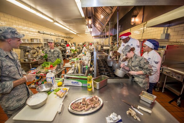 Airmen from the 5th Force Support Squadron prepare their entries during the first Iron Chef Global Strike Challenge competition in the Jimmy Doolittle Center at Minot Air Force Base, N.D., Aug. 10, 2015. At the start of the challenge, competitors were given a secret ingredient — beets, which had to be incorporated into their dishes. (U.S. Air Force photo/ Airman 1st Class Justin T. Armstrong)


