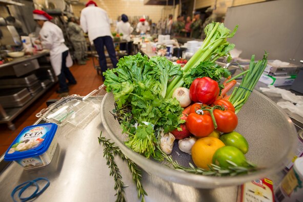 A bowl of produce sits on a handcart as Airmen from the 5th Force Support Squadron prepare their food during the first Iron Chef Global Strike Challenge competition in the Jimmy Doolittle Center at Minot Air Force Base, N.D., Aug. 10, 2015. 
The judges included: Col. Jason Armagost, 5th Bomb Wing commander; Col. Michael Lutton, 91st Missile Wing commander; Col. Kelvin Townsend, 91st MW vice commander; Col. Roy Collins, 5th Mission Support Group commander; and Chief Master Sgt. Dugger, 5th FSS superintendent. (U.S. Air Force photo/ Airman 1st Class Justin T. Armstrong)


