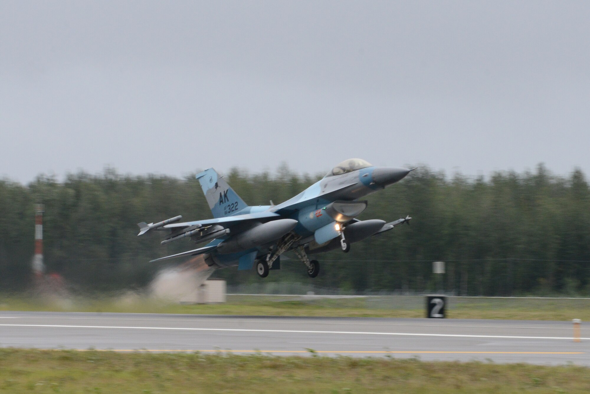 A U.S. Air Force F-16 Fighting Falcon assigned to the 18th Aggressor Squadron takes off from Eielson Air Force Base, Alaska, Aug. 10, 2015, during RED FLAG-Alaska (RF-A) 15-3. RF-A is a series of Pacific Air Forces commander-directed field training exercises for U.S. and partner nation forces, providing combined offensive counter-air, interdiction, close air support and large force employment training in a simulated combat environment. (U.S. Air Force photo by Senior Airman Ashley Nicole Taylor/Released)
