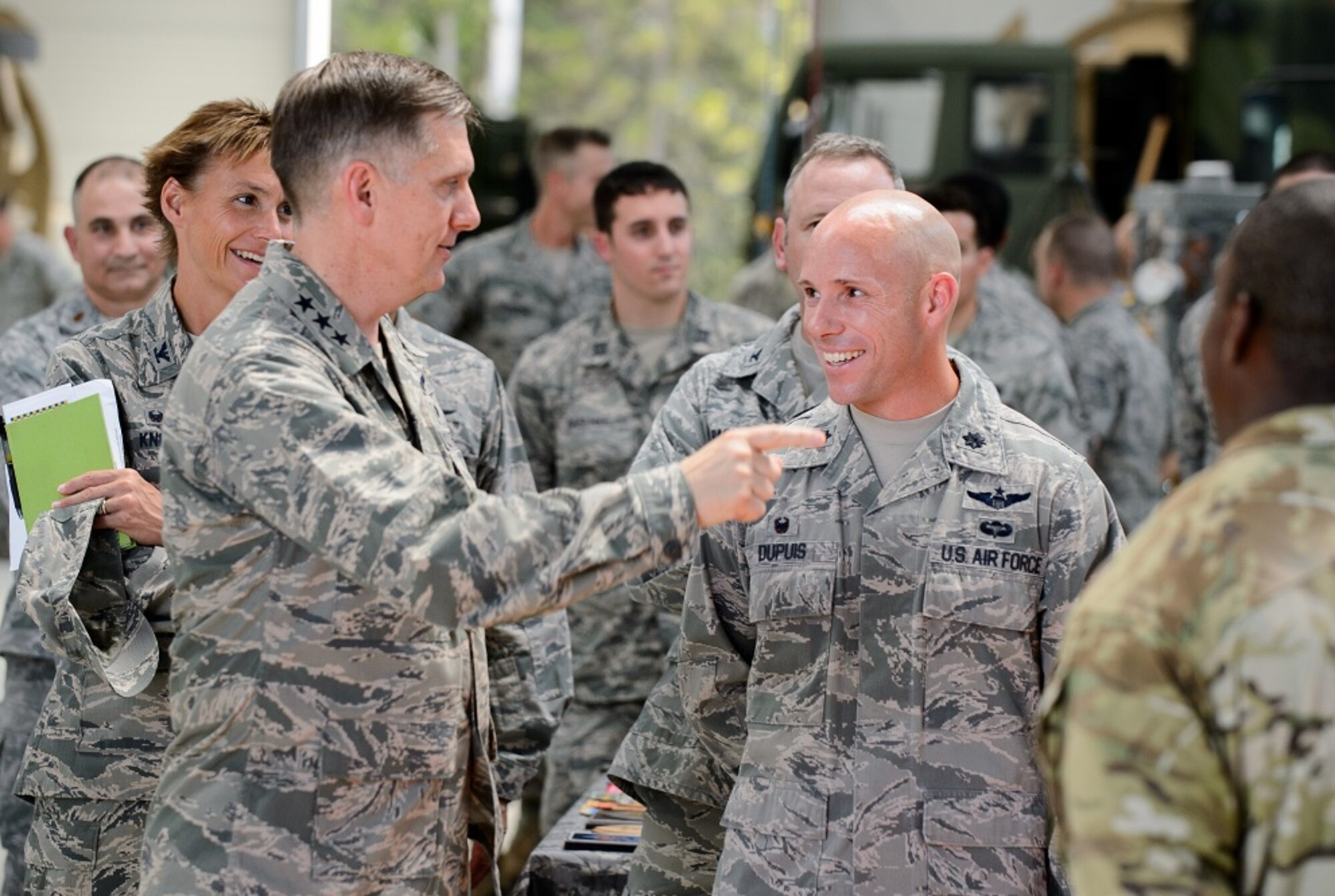 Lt. Col. Justin Dupuis, 2nd Air Support Operations Squadron commander and members of the 435th Air Ground Operations Wing listen to Lt. Gen. Timothy M. Ray, 3rd Air Force commander, during an immersion tour Aug. 6, 2015, at Ramstein Air Base, Germany. Ray visited the 435th AGOW and 435th Air Expeditionary Wing to view what they brought to the European and African theaters of operation. (U.S. Air Force photo/ Staff Sgt. Armando A. Schwier-Morales)