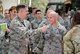 Lt. Col. Justin Dupuis, 2nd Air Support Operations Squadron commander and members of the 435th Air Ground Operations Wing listen to Lt. Gen. Timothy M. Ray, 3rd Air Force commander, during an immersion tour Aug. 6, 2015, at Ramstein Air Base, Germany. Ray visited the 435th AGOW and 435th Air Expeditionary Wing to view what they brought to the European and African theaters of operation. (U.S. Air Force photo/ Staff Sgt. Armando A. Schwier-Morales)