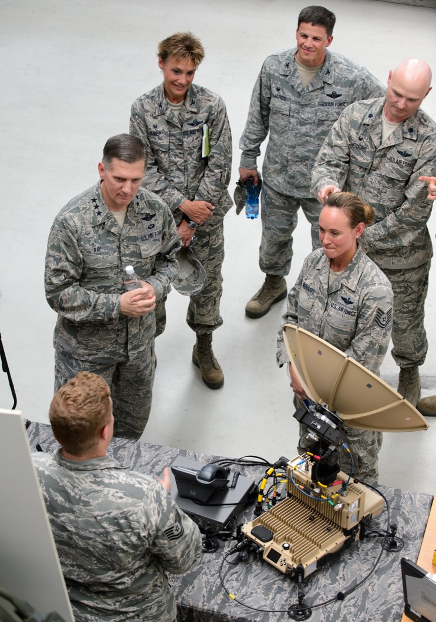 Lt. Gen. Timothy M. Ray, 3rd Air Force commander, and leaders from the 435th Air Ground Operations and Air Expeditionary Wings listen to Airmen present their missions during an immersion tour Aug. 6, 2015, at Ramstein Air Base, Germany. The 435th AGOW Airmen showcased the wing’s five mission sets, which are to deploy expeditionary airfields on demand, provide operations sustainment and support, deliver premier expeditionary training, integrate joint air power and build partnerships.  (U.S. Air Force photo/ Staff Sgt. Armando A. Schwier-Morales)