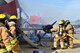 Fire fighters from Hancock Field Air National Guard Base respond to a simulated aircraft crash as part of a large scale Major Accident Response Exercise (MARE) held at Syracuse Hancock Internal Airport, Aug. 8. The emergency training included components from the 174th Attack Wing, airlines, air traffic controllers, engineers, the Transportation Security Administration, local police, and firefighters. (New York Air National Guard photo by Senior Airman Duane Morgan/Released)