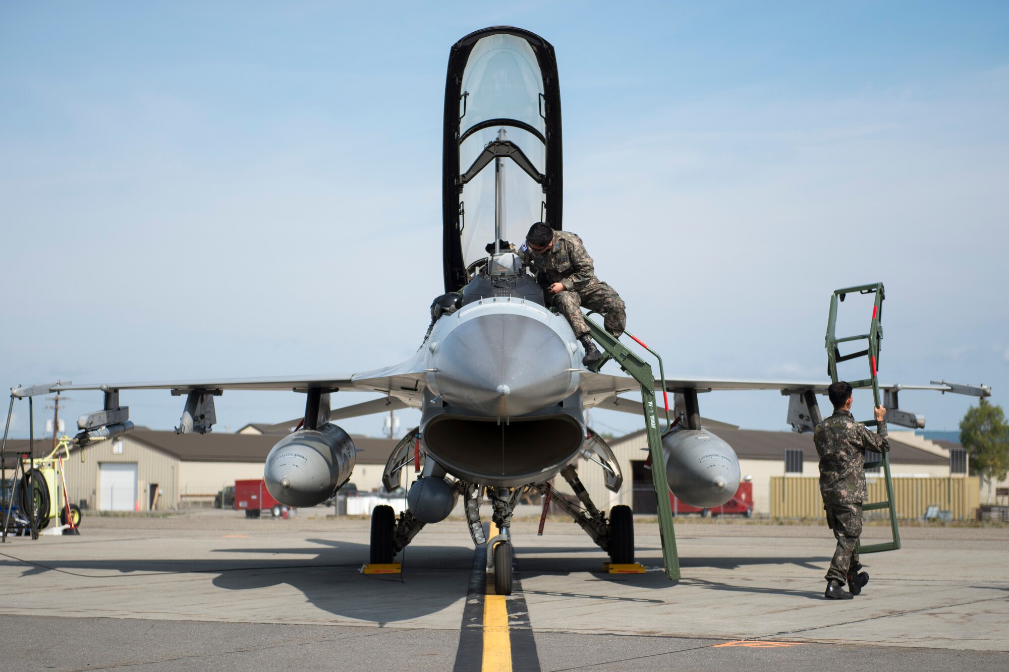 Members of the Republic of Korea Air Force (ROKAF) inspect their F-16D Fighting Falcon prior to launch at Eielson Air Force Base, Alaska, Aug. 4, 2015. The ROKAF is participating in RED FLAG-Alaska 15-3, a Pacific Air Forces commander-directed field training exercise for U.S. and partner nation forces, providing combined offensive counter-air, interdiction, close air support and large force employment training in a simulated combat environment. (U.S. Air Force photo by 1Lt Elias Zani/ Released)