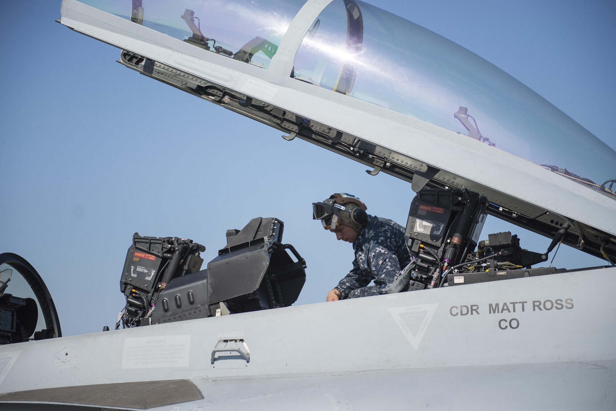 U.S. Navy Airman Monty Lowden, a plane captain assigned to Electronic Attack Squadron 209, Naval Air Station Whidbey Island, Wash., inspects an EA-18G Growler electronic warfare aircraft, Aug. 7, 2015, following a RED FLAG-Alaska (RF-A) 15-3 sortie to ensure the jet maintains operational readiness at Eielson Air Force Base, Alaska. RF-A is a Pacific Air Forces commander-directed field training exercise for U.S. and partner nation forces, providing combined offensive counter-air, interdiction, close air support and large force employment training in a simulated combat environment. (U.S. Air Force photo by 1Lt Elias Zani/Released)