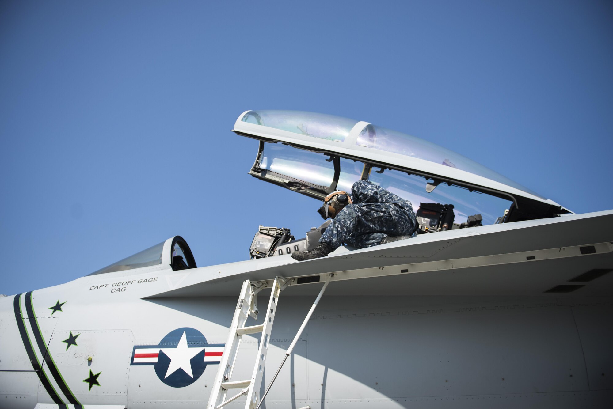 U.S. Navy Airman Monty Lowden, a plane captain assigned to Electronic Attack Squadron 209, Naval Air Station Whidbey Island, Wash., inspects an EA-18G Growler electronic warfare aircraft, Aug. 7, 2015, following a RED FLAG-Alaska (RF-A) 15-3 sortie to ensure the jet maintains operational readiness at Eielson Air Force Base, Alaska. RF-A is a Pacific Air Forces commander-directed field training exercise for U.S. and partner nation forces, providing combined offensive counter-air, interdiction, close air support and large force employment training in a simulated combat environment. (U.S. Air Force photo by 1Lt Elias Zani/Released)