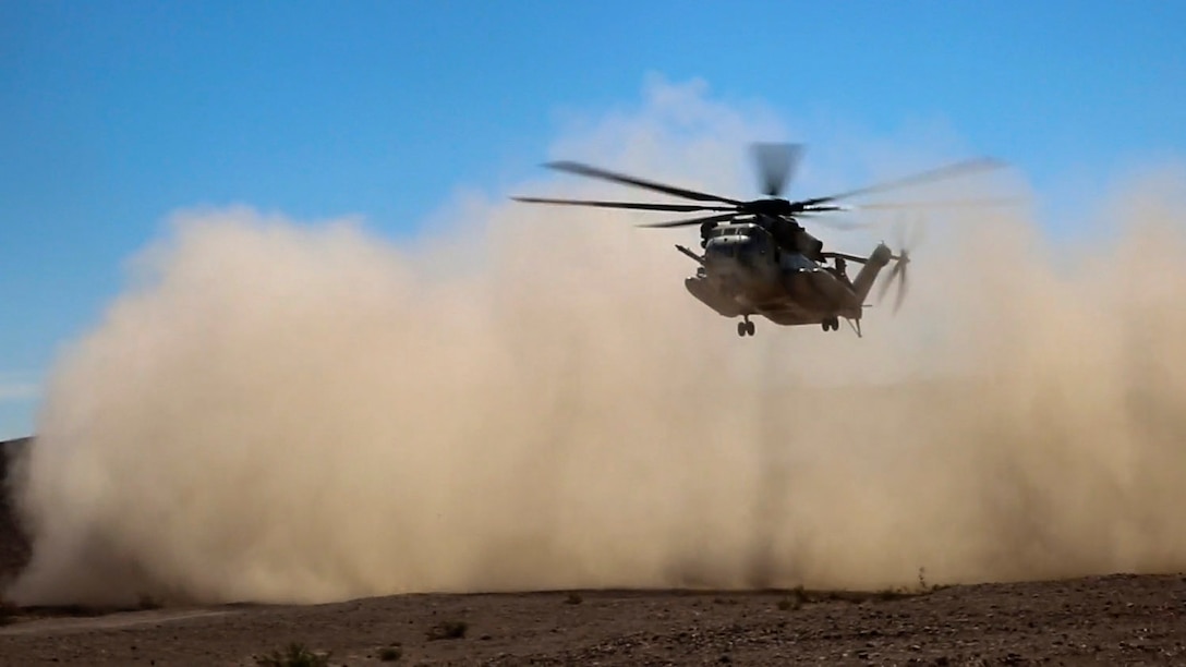 A CH-53E Super Stallion with Marine Heavy Helicopter Squadron 366 descends to a secured landing zone during a simulated casualty evacuation at Marine Corps Air Ground Combat Center Twentynine Palms, California, Aug. 10, 2015. The simulation gave Marines with Combat Logistics Battalion 1, Combat Logistics Regiment 1, 1st Marine Logistics Group an opportunity to prepare for casualty response during future operations.