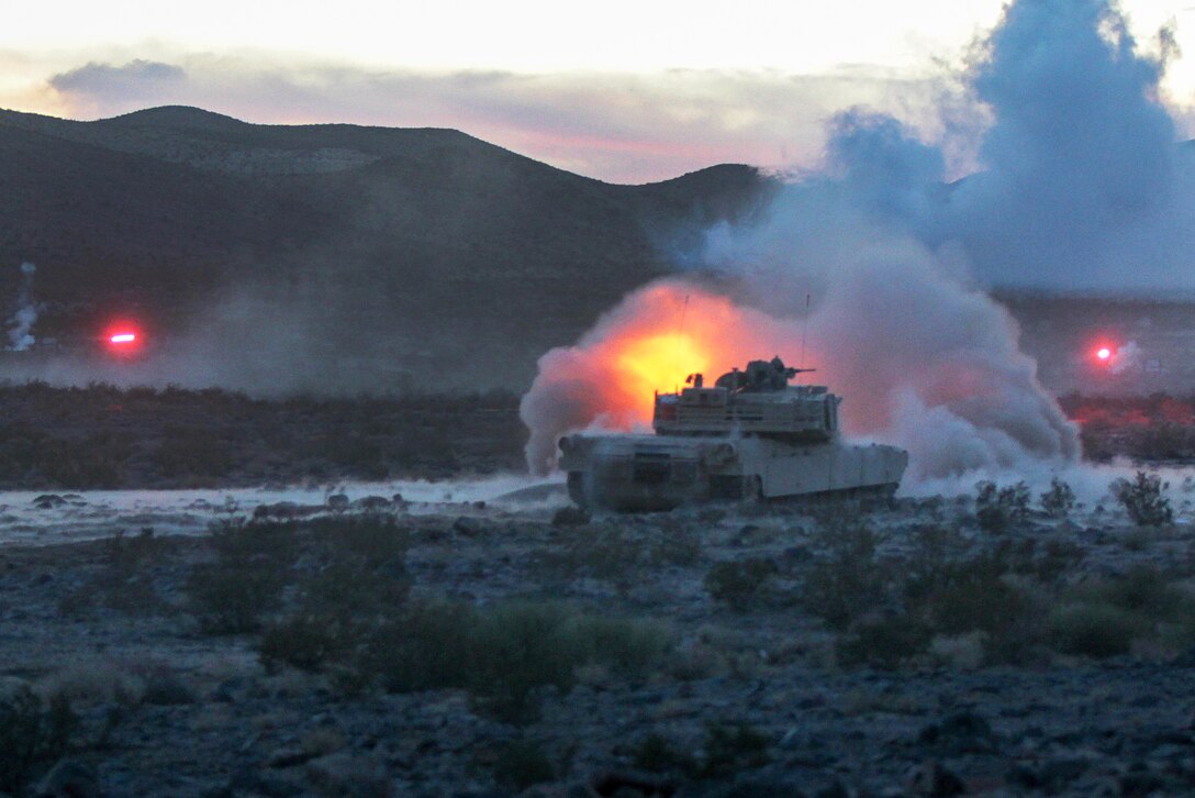 An M1 Abrams tank fires its main gun during a live-fire exercise as part of Operation Dragon Spear on Fort Irwin, Calif., Aug. 5, 2015.