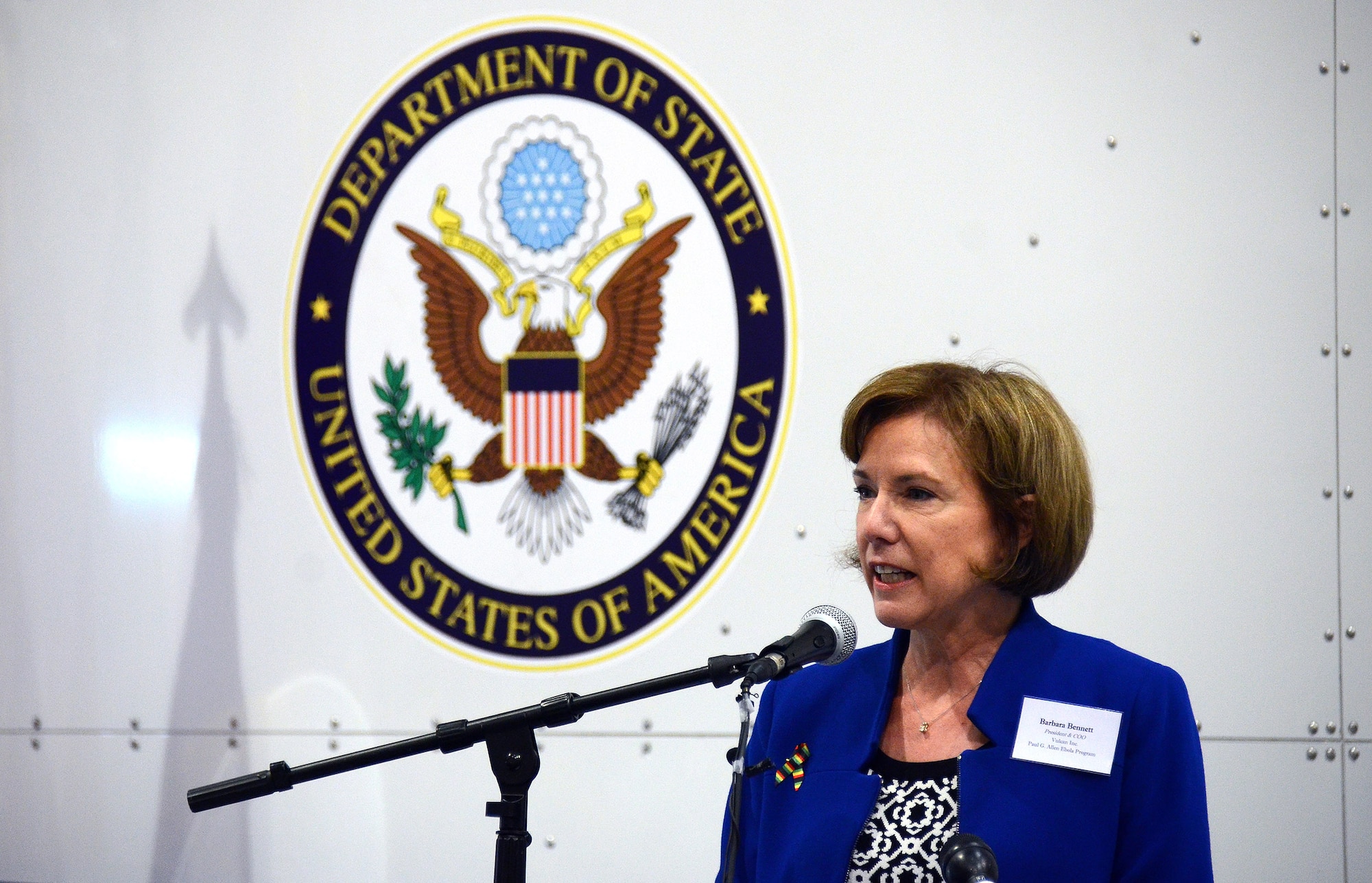 Barbara Bennett, president and chief operating officer Paul G. Allen Ebola Program, gives remarks at the unveiling of the US State Department-sponsored Containerized Biocontainment Systems units at Dobbins Air Reserve Base, Ga., Aug. 11, 2015. The two Containerized Biocontainment units were built by MRIGlobal through a partnership with the U.S. State Dept. and the Paul G. Allen Ebola Program, and will be positioned at Dobbins ARB, ready for future. (U.S. Air Force photo/ Brad Fallin)