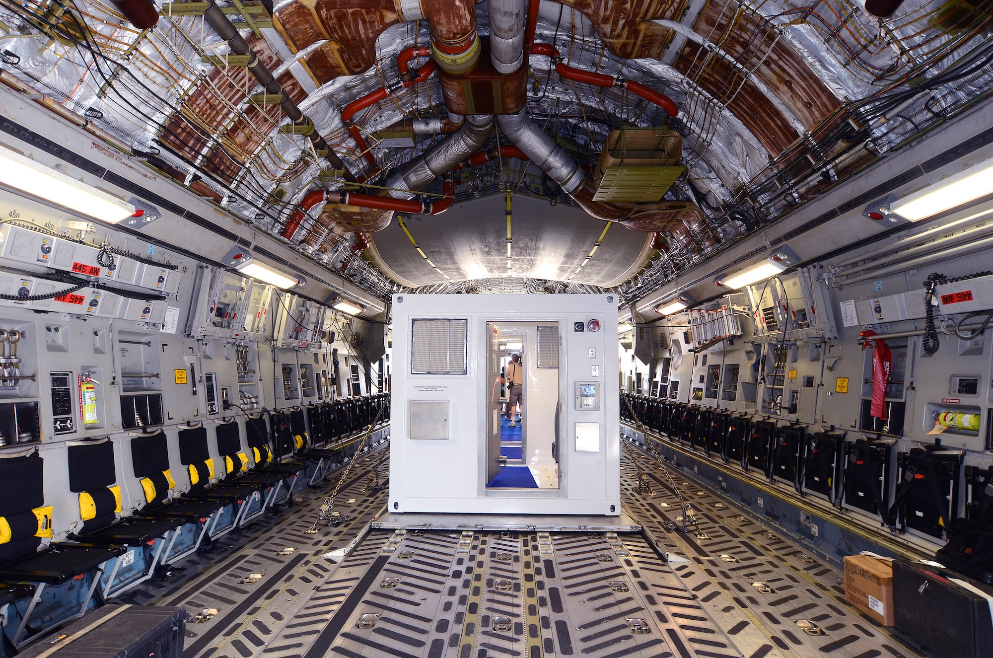The second Containerized Biocontainment Systems unit is positioned on a U.S. Air Force C-17 to show how the unit could be airlifted to anywhere in the world if needed; Dobbins Air Reserve Base, Ga., Aug. 11, 2015. The two Containerized Biocontainment units built by MRIGlobal through a partnership with the U.S. State Dept. and the Paul G. Allen Ebola Program, will be positioned at Dobbins ARB, ready for future. (U.S. Air Force photo/ Brad Fallin)