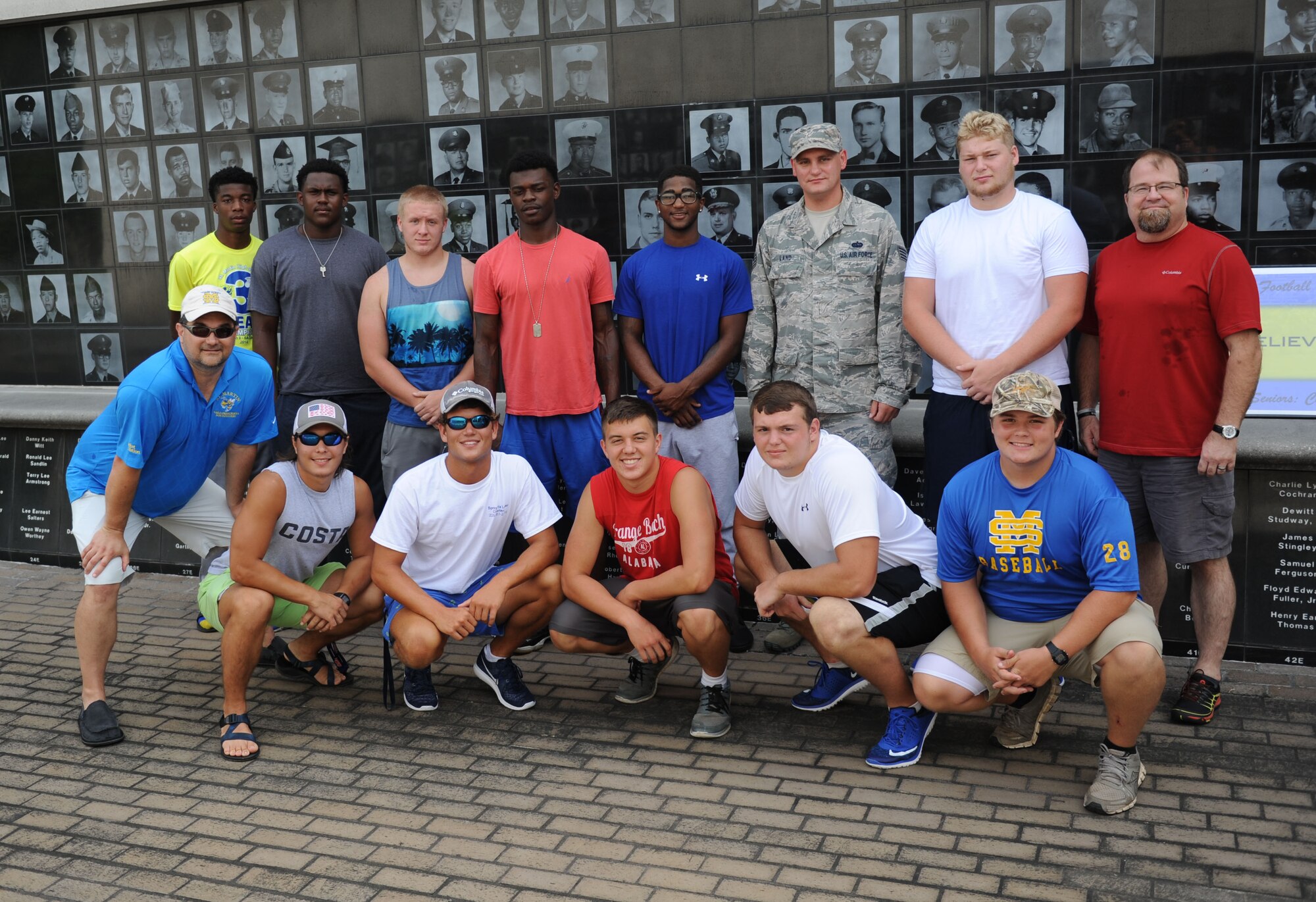 Keesler personnel take a photo with St. Martin High School senior football players during a leadership seminar Aug. 8, 2015, at the Mississippi Vietnam Veterans Memorial in Ocean Springs, Miss. The seminar was a collaboration of the St. Martin Gridiron Club and Keesler personnel, who briefed the students on good attitudes, values, beliefs and teamwork. (U.S. Air Force photo by Kemberly Groue)