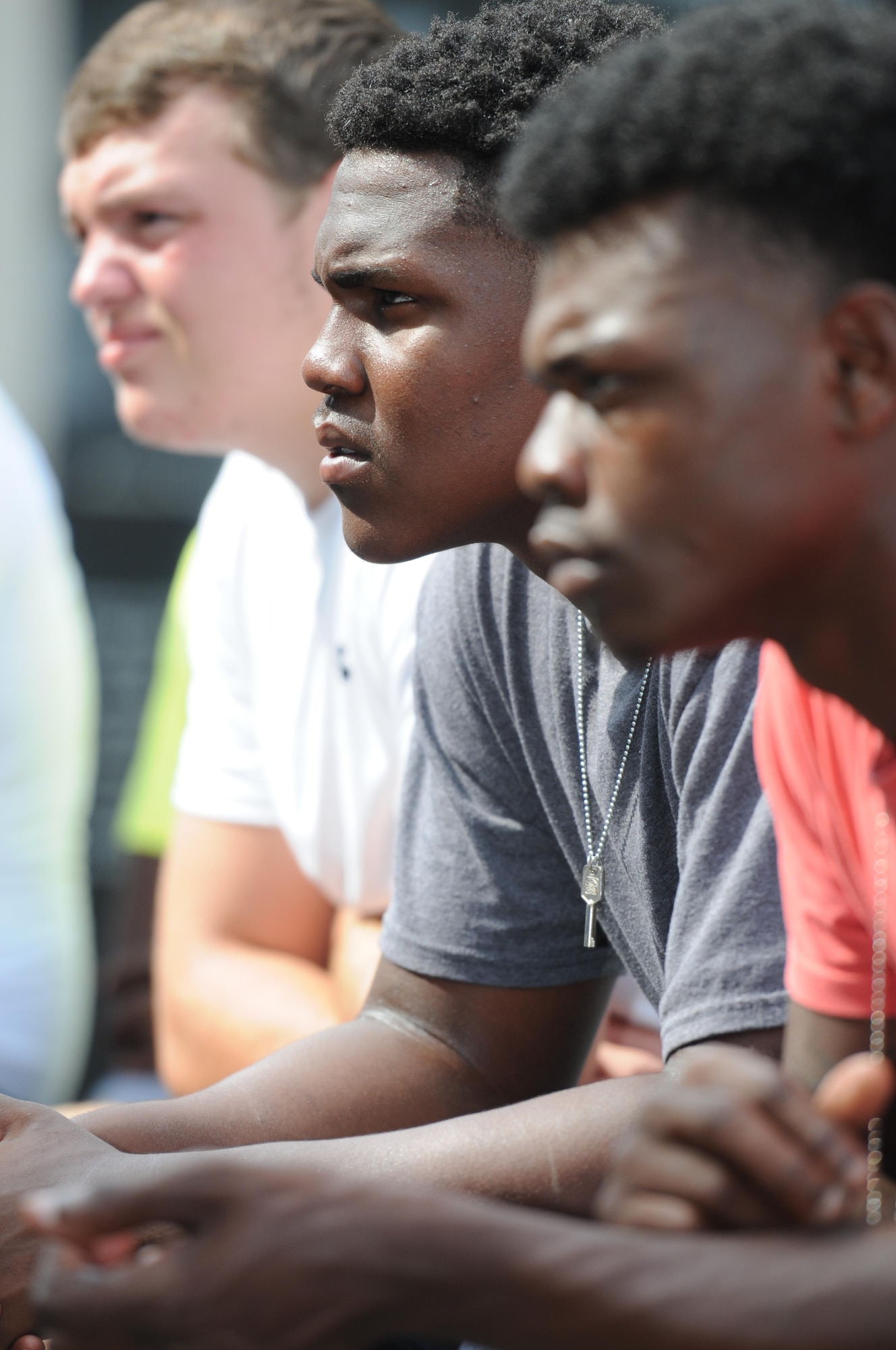 Trey Freeman, Jimon Dixon and Quincy Brown, St. Martin High School senior football players, pay attention during a leadership seminar Aug. 8, 2015, at the Mississippi Vietnam Veterans Memorial in Ocean Springs, Miss. The seminar was a collaboration of the St. Martin Gridiron Club and Keesler personnel, who briefed the students on good attitudes, values, beliefs and teamwork.  (U.S. Air Force photo by Kemberly Groue)