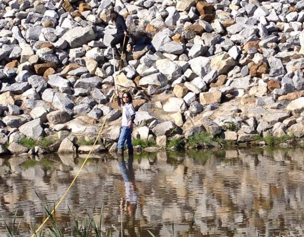 Veronica Li (foreground) and Sophia Ma (background) take California Rapid Assessment Method measurements in San Diego Creek in Orange County for the Orange County Transit Authority Measure M2 Freeway Program. (Photo courtesy of Sarvy Mahdavi, US EPA)