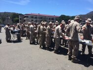 Marines go through the chow line after completing a 6 mile patrol movement.