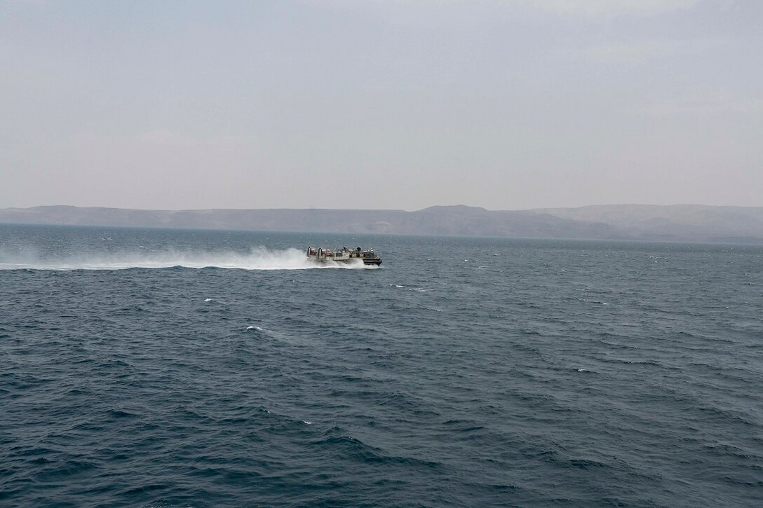 GULF OF ADEN (Aug. 6, 2015) A U.S. Navy landing craft, air cushion departs  the amphibious transport dock ship USS Anchorage (LPD 23) to Djibouti for a routine personnel and cargo movement. The Marines of the 15th Marine Expeditionary Unit are embarked aboard the Anchorage, which is part of the Essex Amphibious Ready Group and is deployed in support of maritime security operations and theater security cooperation efforts in the U.S. 5th Fleet area of operations. (U.S. Marine Corps photo by Sgt. Steve H. Lopez/Released)