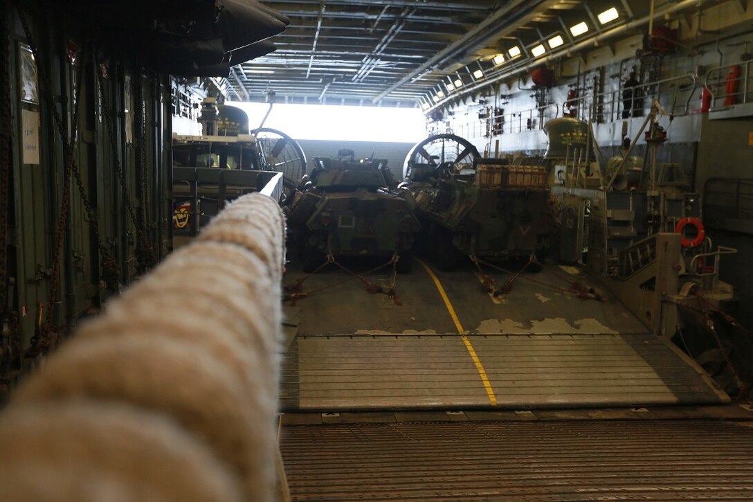 GULF OF ADEN (Aug. 6, 2015) A U.S. Navy landing craft, air cushion prepares to depart the well deck of the amphibious transport dock ship USS Anchorage (LPD 23) to Djibouti during a routine personnel and cargo movement. The Marines of the 15th Marine Expeditionary Unit are embarked aboard the Anchorage, which is part of the Essex Amphibious Ready Group and is deployed in support of maritime security operations and theater security cooperation efforts in the U.S. 5th Fleet area of operations. (U.S. Marine Corps photo by Sgt. Steve H. Lopez/Released)
