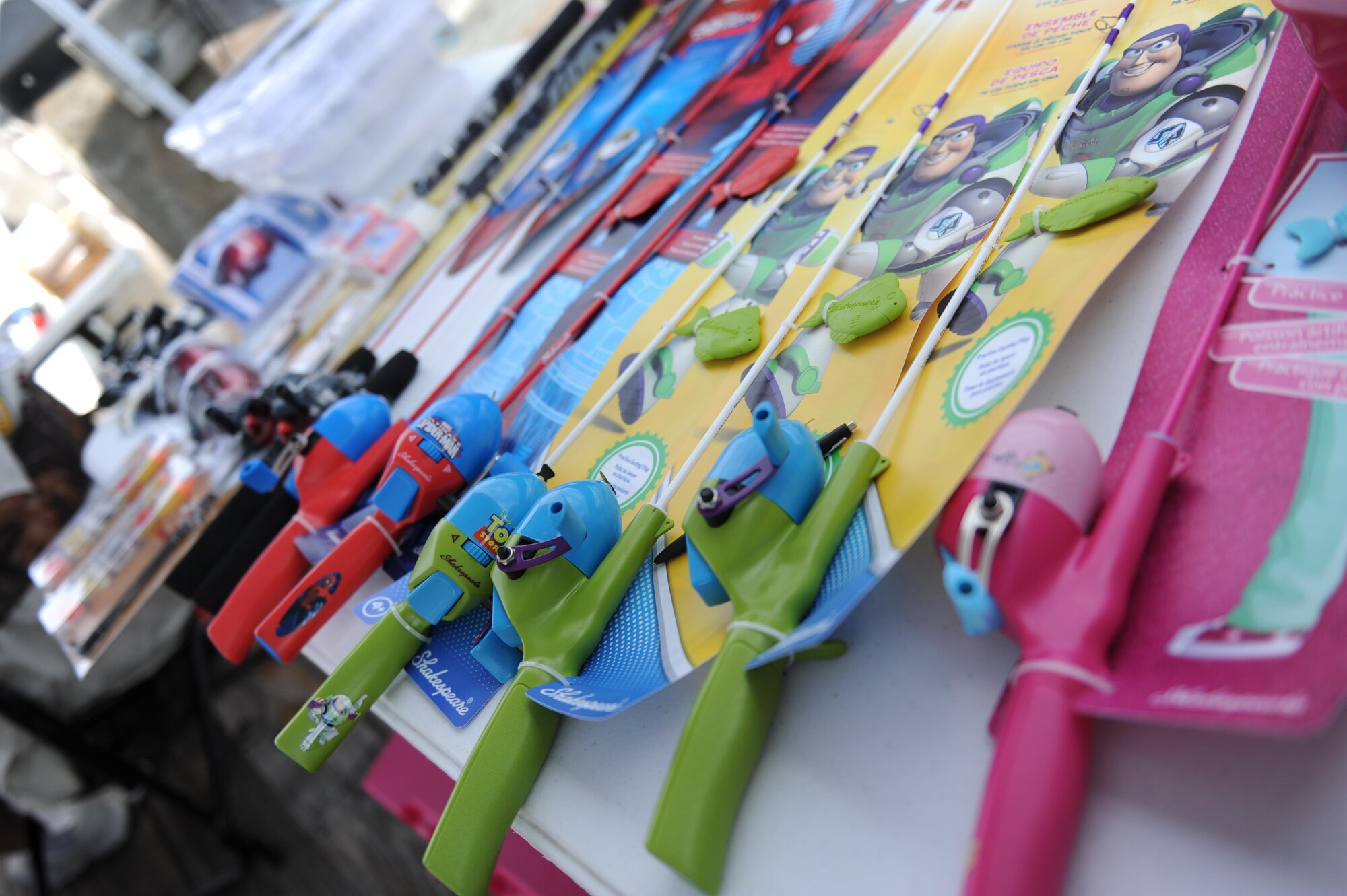 Sets of fishing poles sit on display as prizes during the Kid’s Fishing Rodeo Aug. 8, 2015, at the marina, Keesler Air Force Base, Miss. The event was hosted by the outdoor recreation center and Gulfport Elks Lodge.  (U.S. Air Force photo by Kemberly Groue)