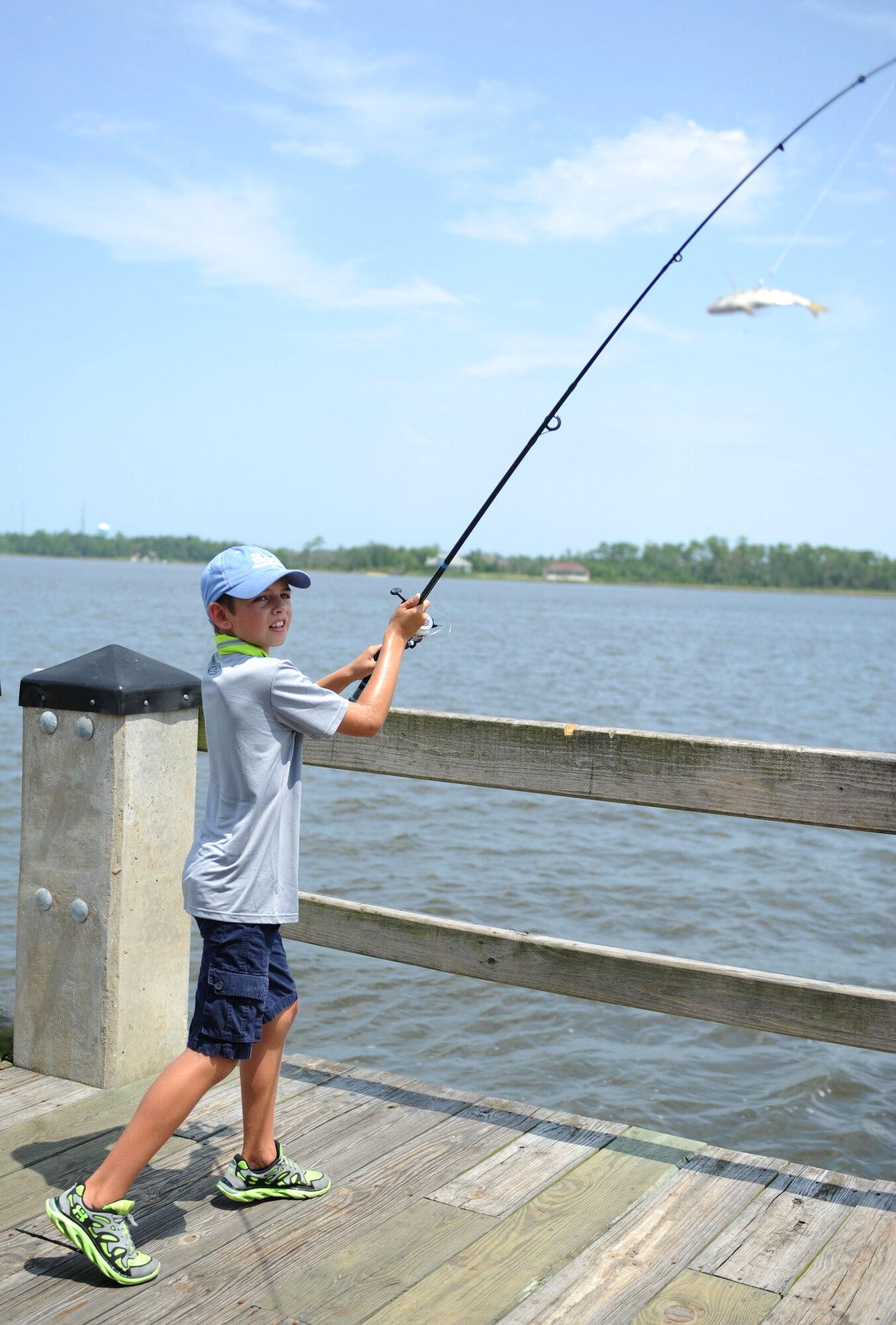Callahan McGowan, son of Col. Michele Edmondson, 81st Training Wing commander, casts out his bait into the Biloxi Back Bay during the Kid’s Fishing Rodeo Aug. 8, 2015, at the marina, Keesler Air Force Base, Miss. The event was hosted by the outdoor recreation center and Gulfport Elks Lodge. (U.S. Air Force photo by Kemberly Groue)