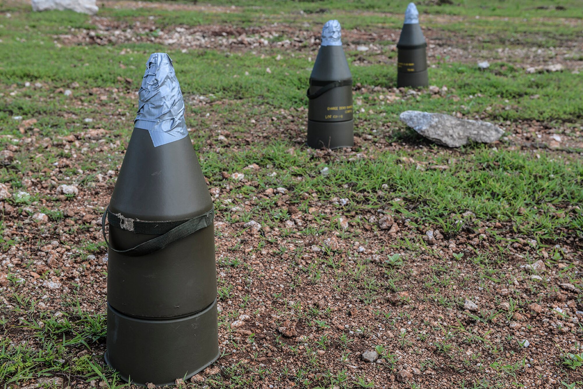 Several 15-pound demolition charges are set for detonation Aug. 12, 2015, at Andersen Air Force Base, Guam. 554th RED HORSE Squadron explosive demolition team members are tasked with discharging explosives to deny base access or blasting rock quarries for raw construction material. (U.S. Air Force photo by Senior Airman Joshua Smoot/Released)