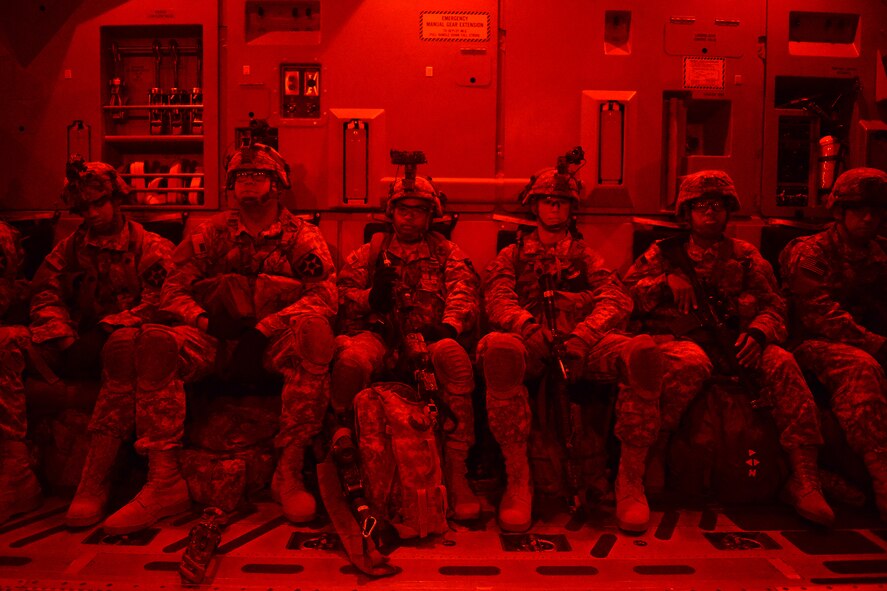 Airmen from the 62nd Airlift Wing prepare to deliver Soldiers from the 82nd Airborne Division and 7th Infantry Division Aug. 6, 2015, to the National Training Center, Calif., during a Joint Operation Access Exercise. The 62nd AW delivered the Soldiers via air land operations on an airstrip paratroopers from the 82nd Airborne Division simulated taking over from a simulated enemy force.  (U.S. Air Force photo\ Staff Sgt. Tim Chacon)
